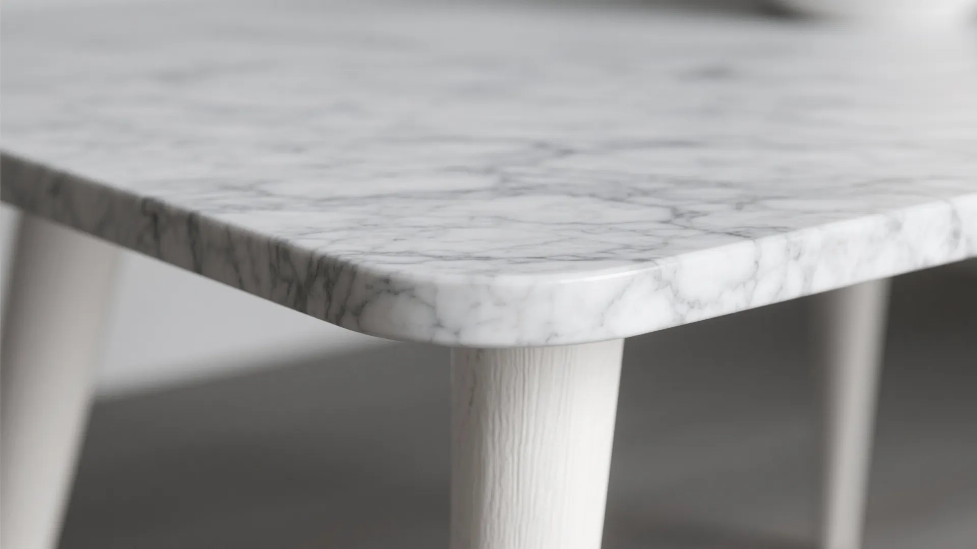 4. Gray marble-look tabletop with white tapered legs