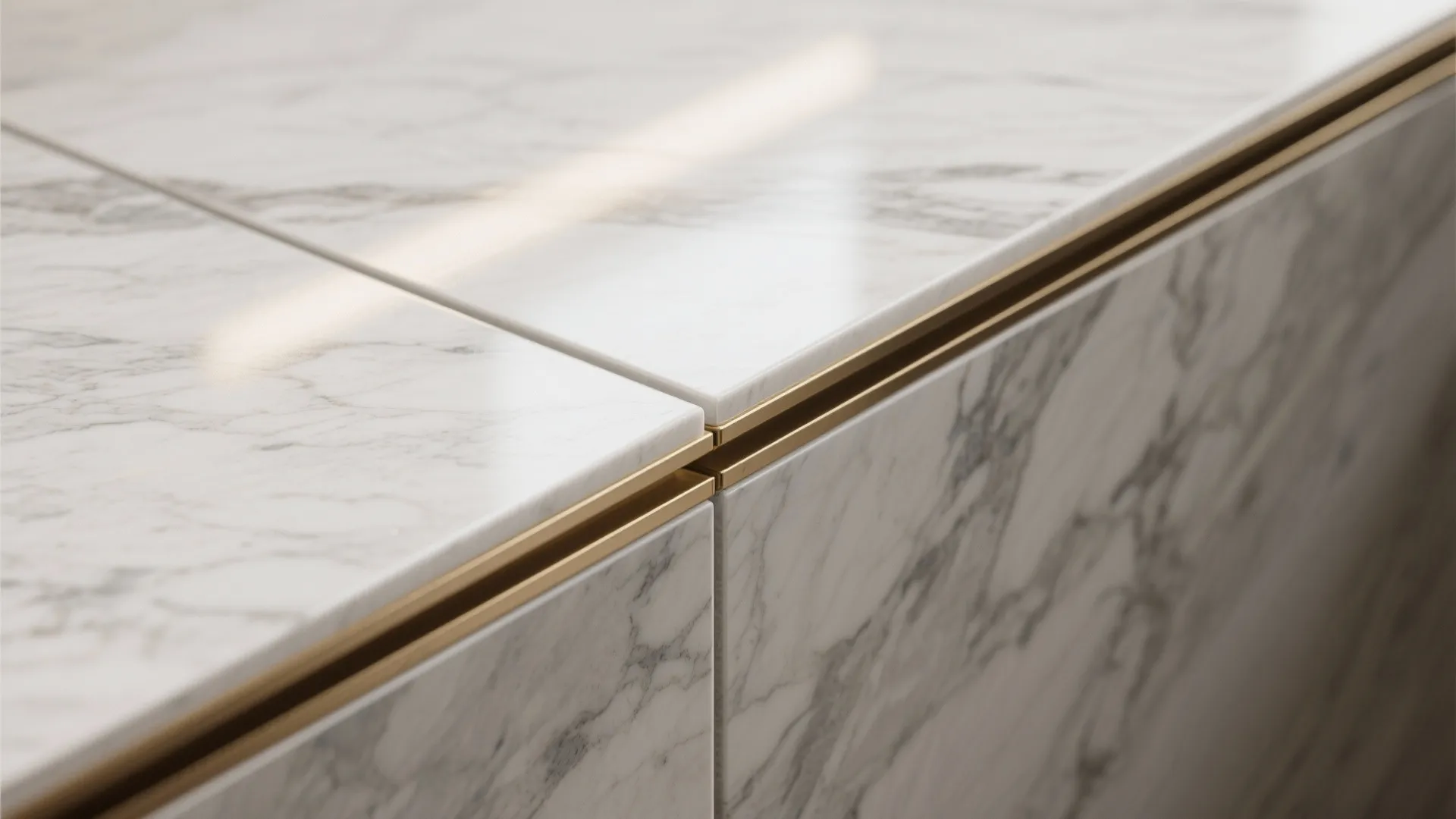Close up of white marble cabinet with gold metal trim detailing in modern interior design