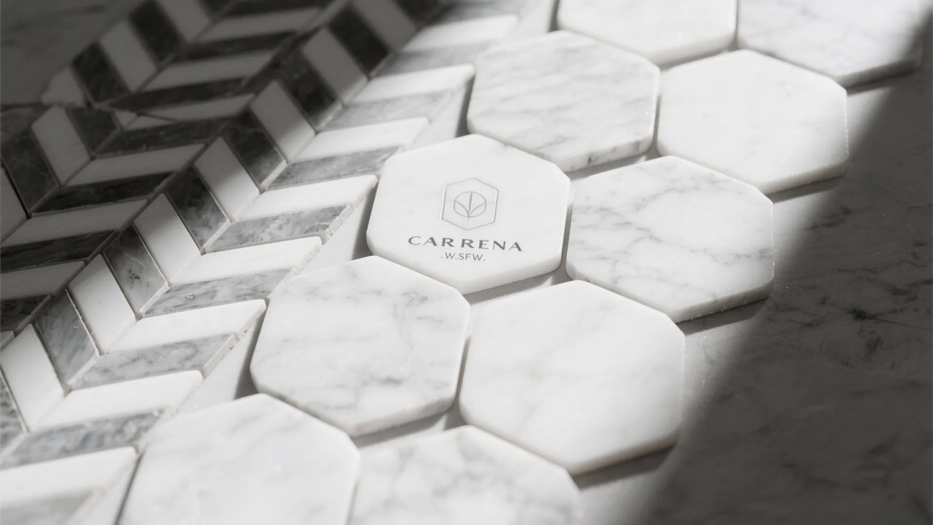 Close up of white marble hexagon floor tiles and grey chevron pattern tiles with natural light