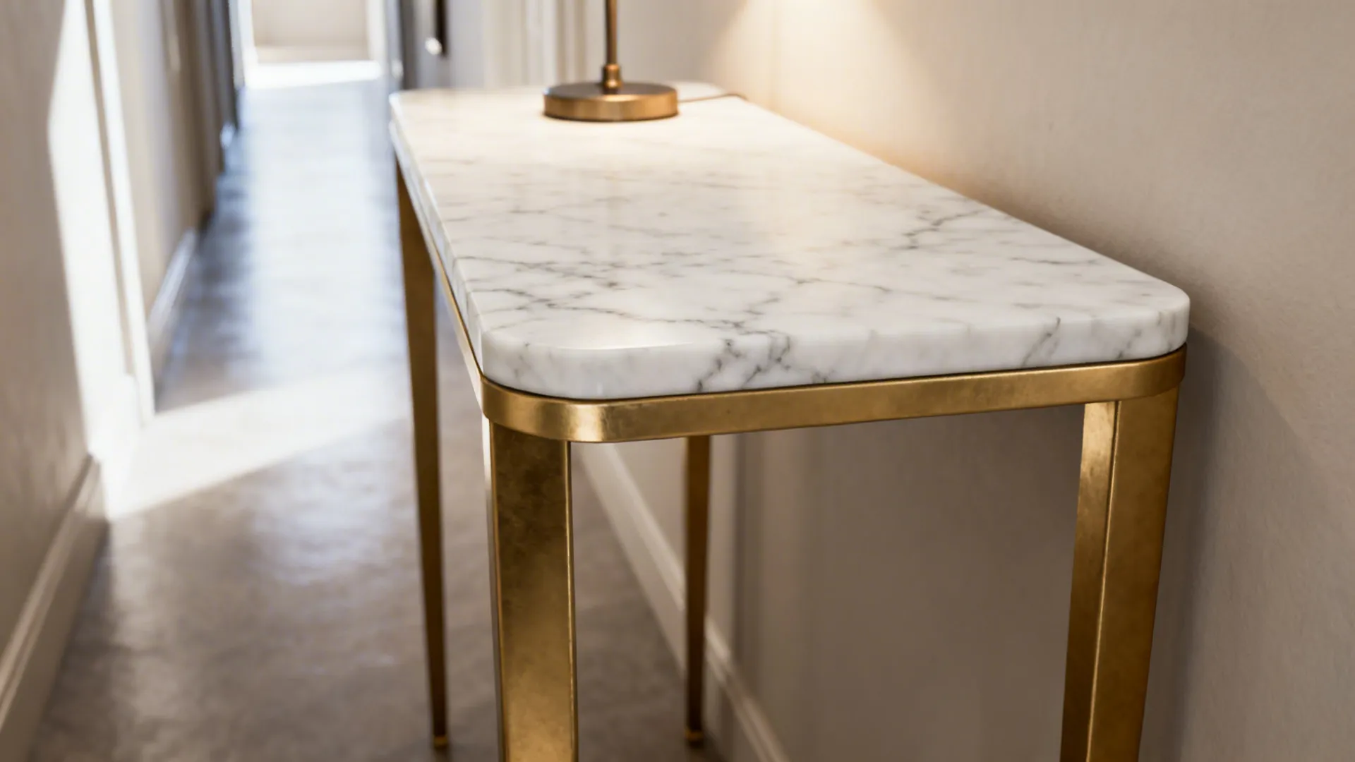 Marble-top gold end table with slender legs showing marble veining and brushed gold frame.