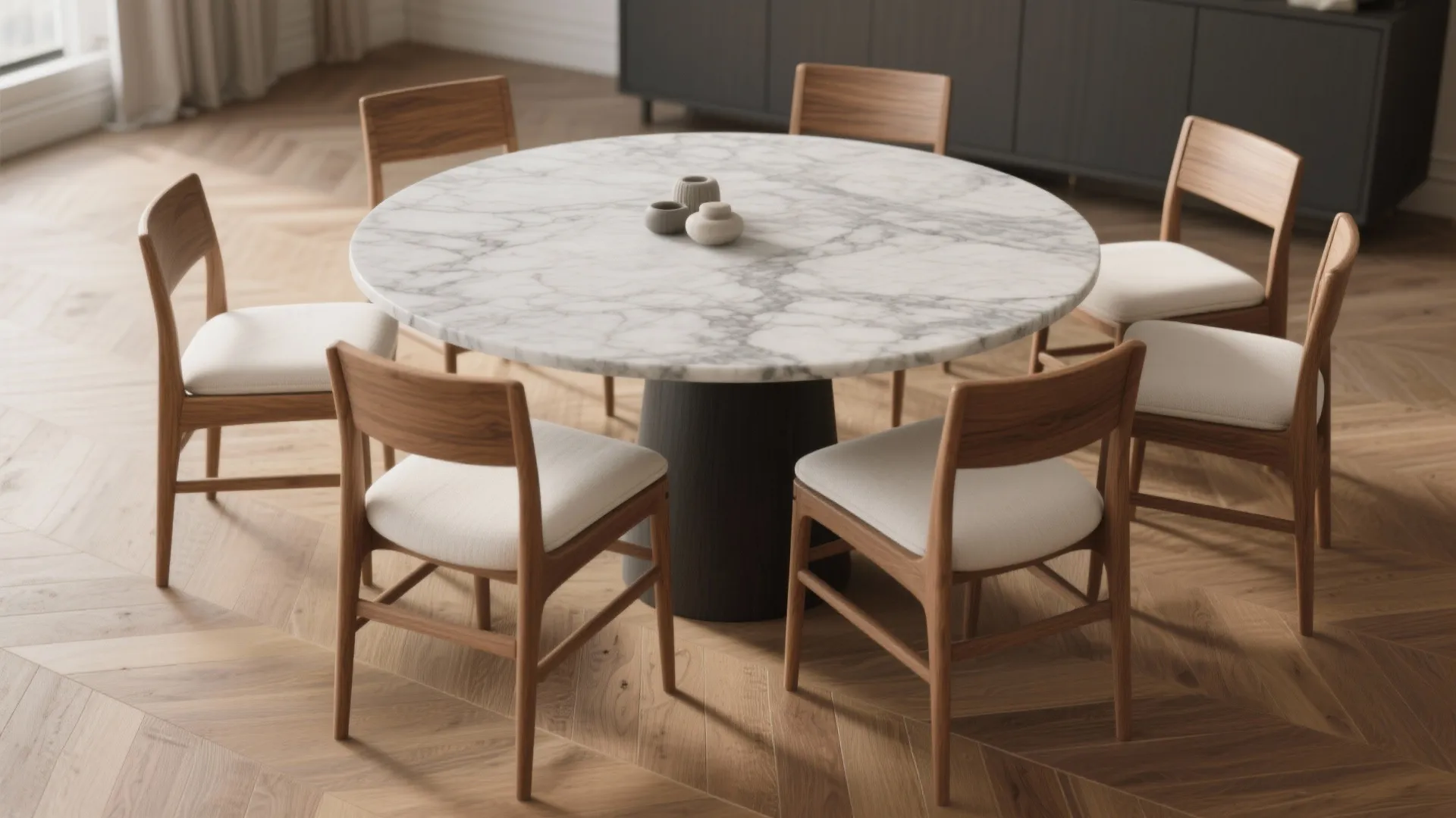 Round marble dining table with six wooden chairs placed on a light brown wood patterned floor