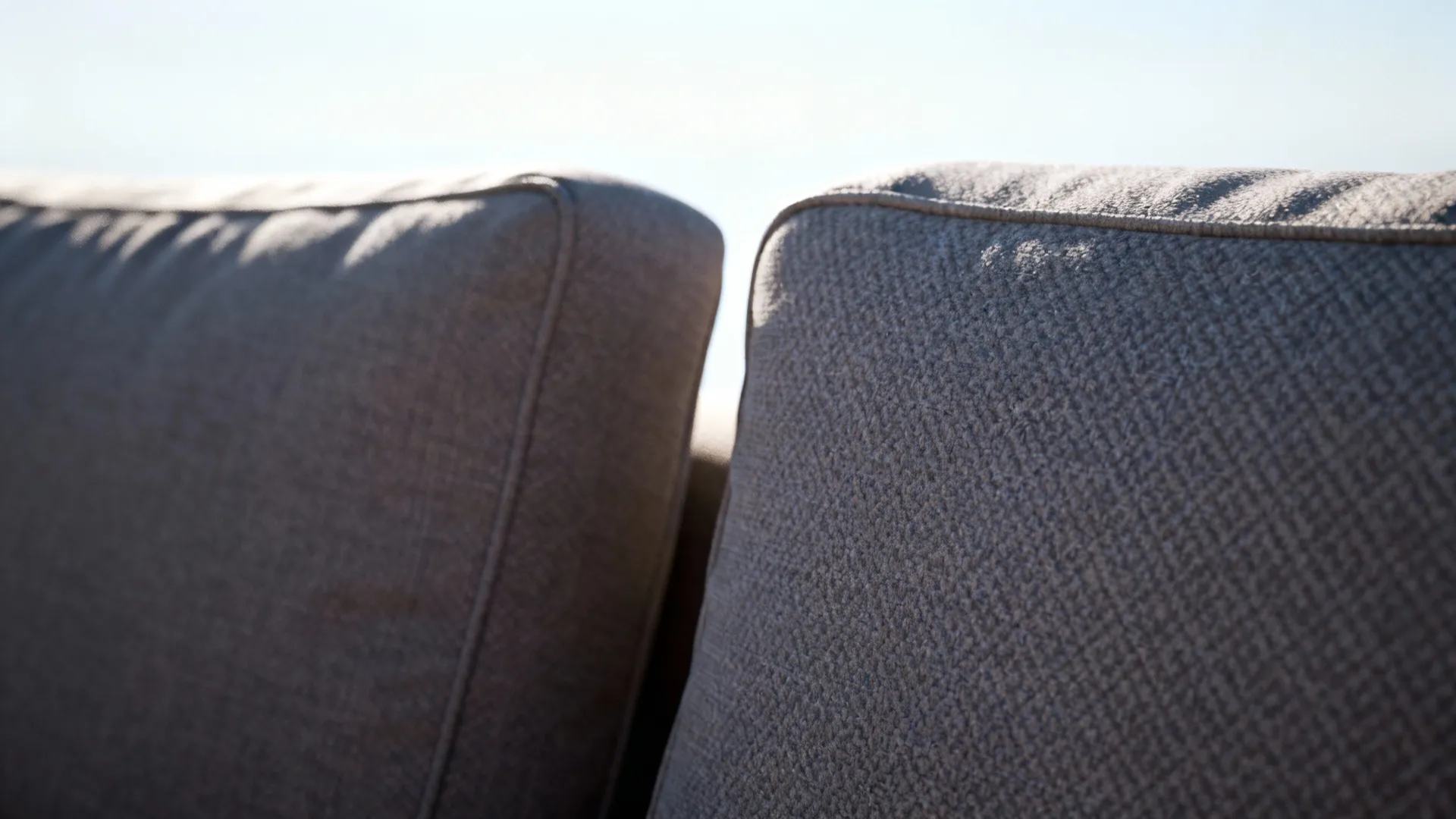 Matching couch back heights and complementary fabrics creating a clean sightline