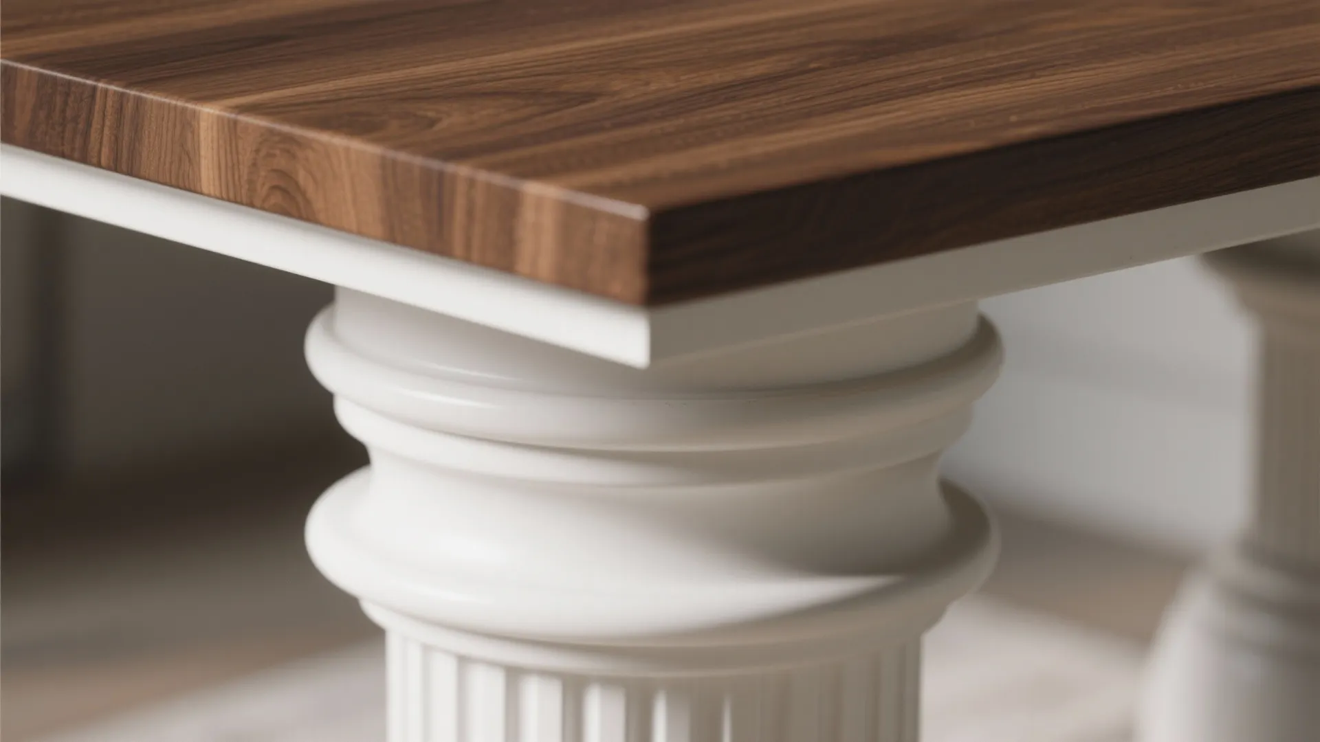 Close-up of white pedestal base joined to a warm walnut tabletop highlighting material contrast