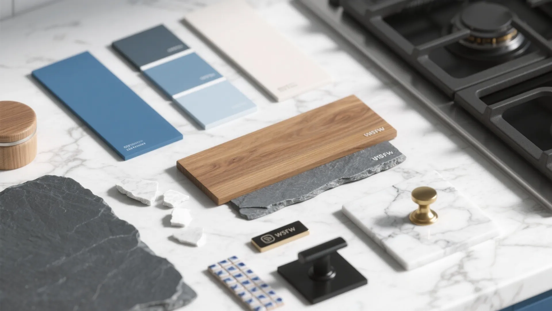 Selection of kitchen materials including blue paint chips wood plank stone and metal cabinet handles