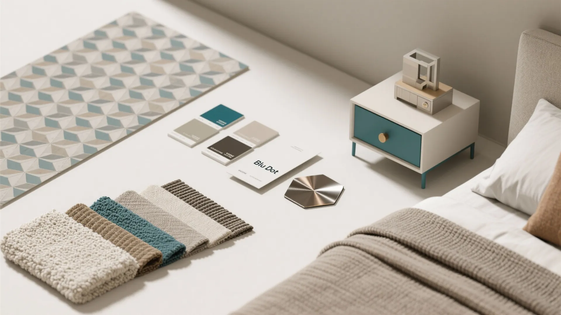 Flatlay of paint, wallpaper, and fabric samples for planning a Blu Dot bedroom design.