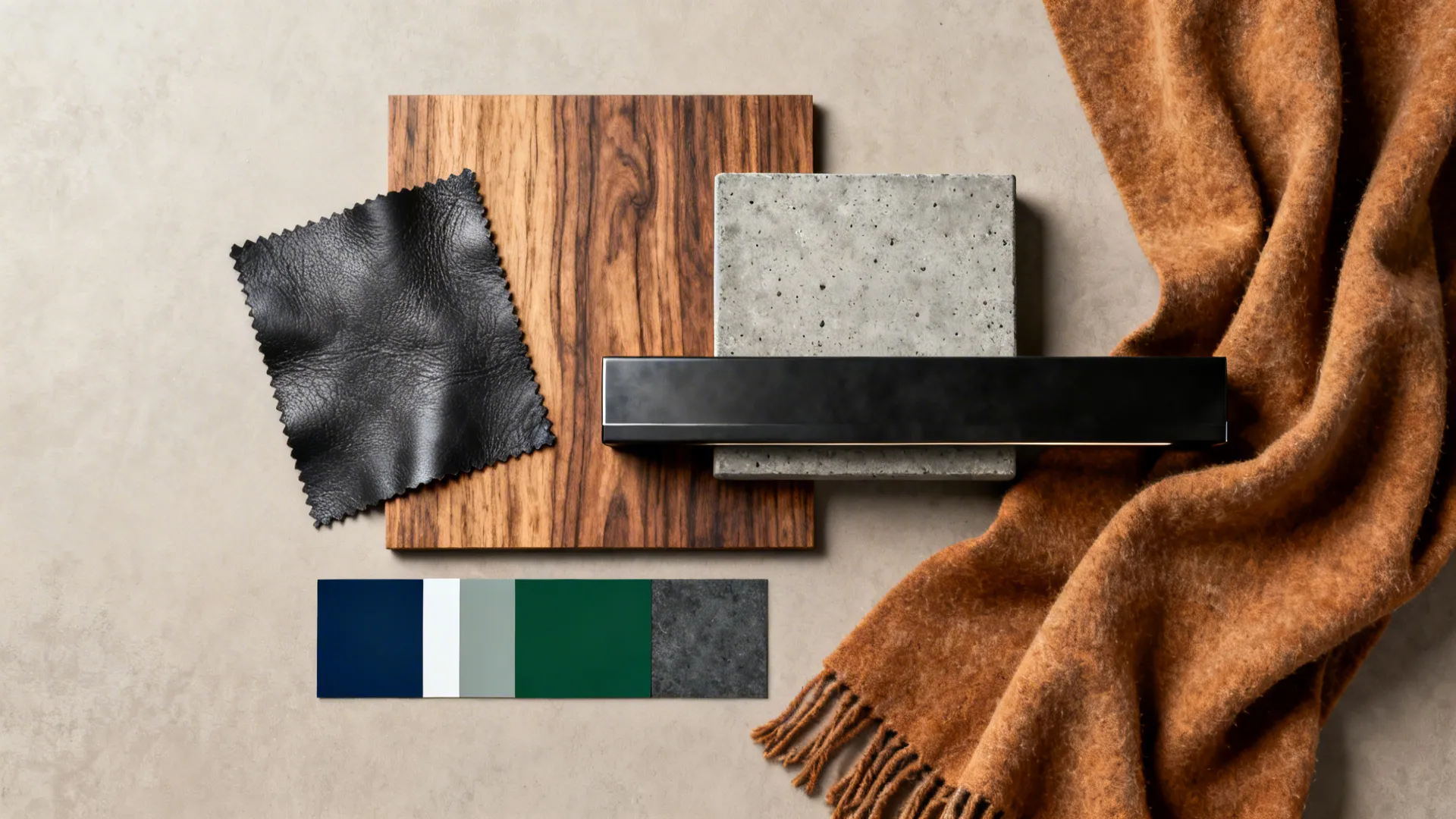 Flatlay of material samples: leather, wood veneer, concrete tile, matte black metal, and textile swatches.