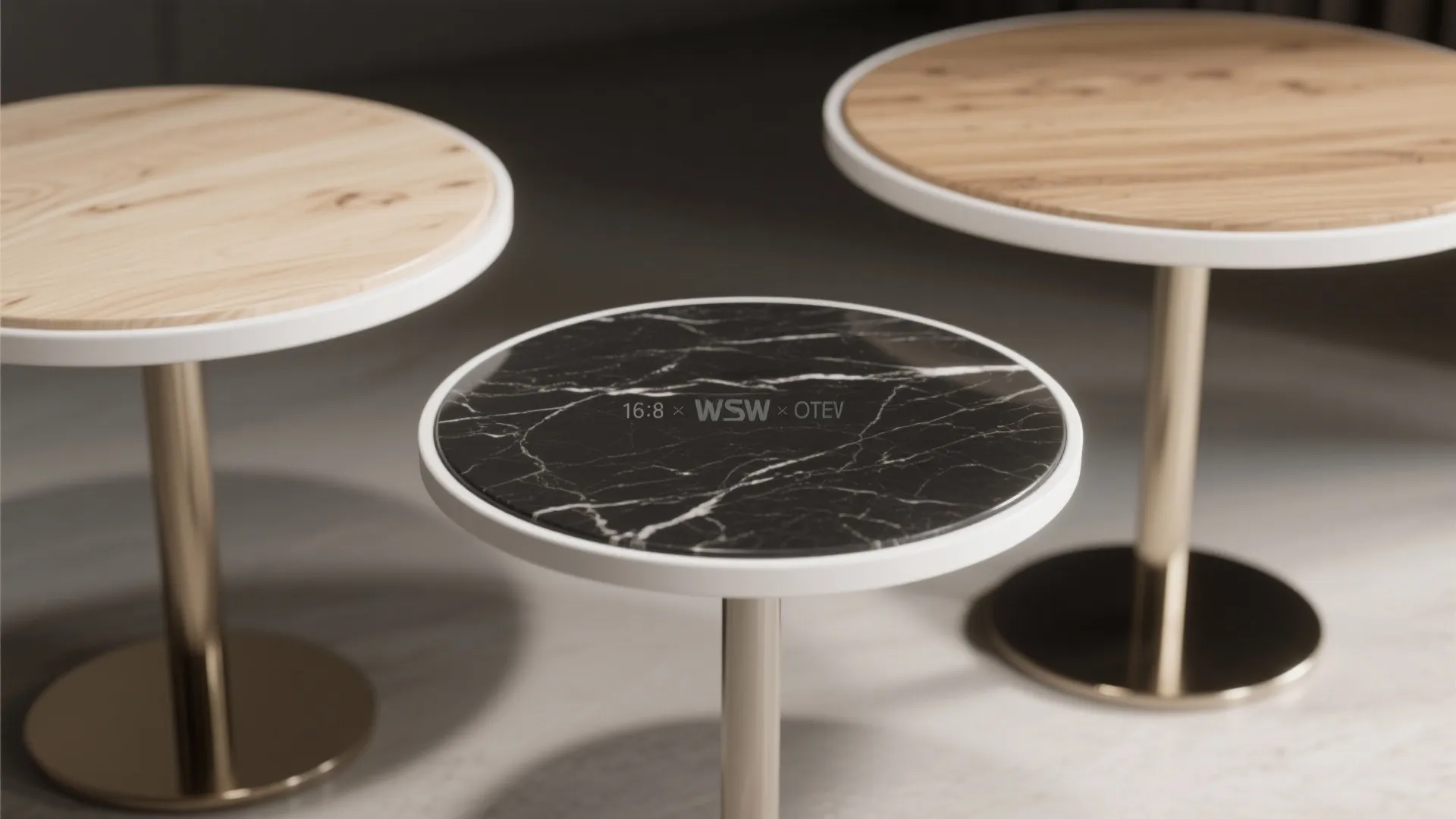 Three small round side tables with wood and black marble tops and simple metal leg bases