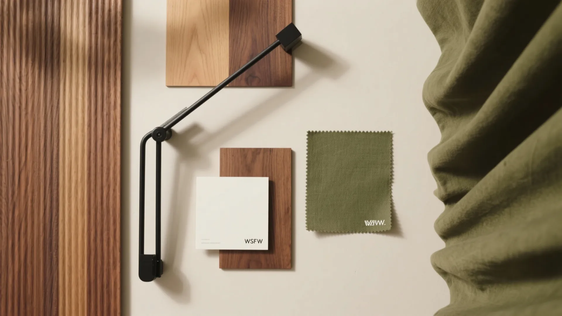 Interior design mood board with wood samples green fabric swatch white tile and wall light