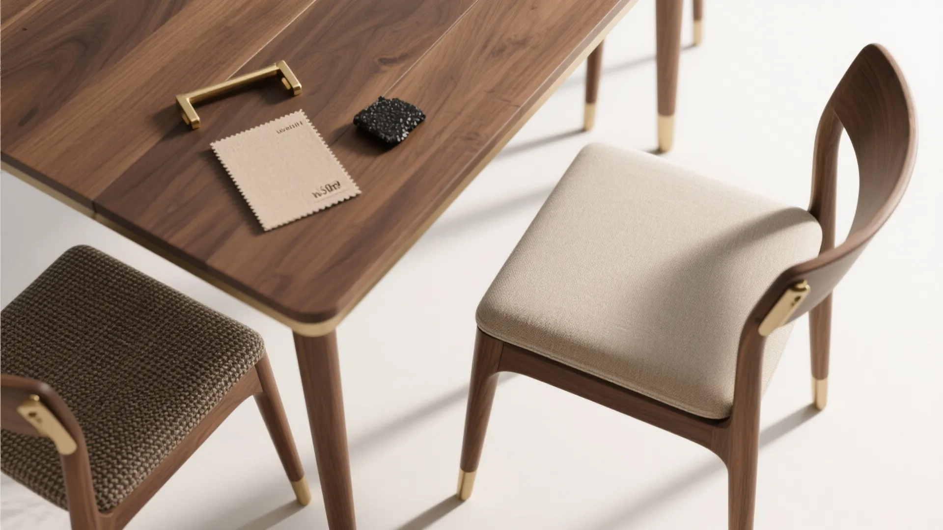 Modern wooden dining table with fabric chairs and gold metal details showing interior design materials