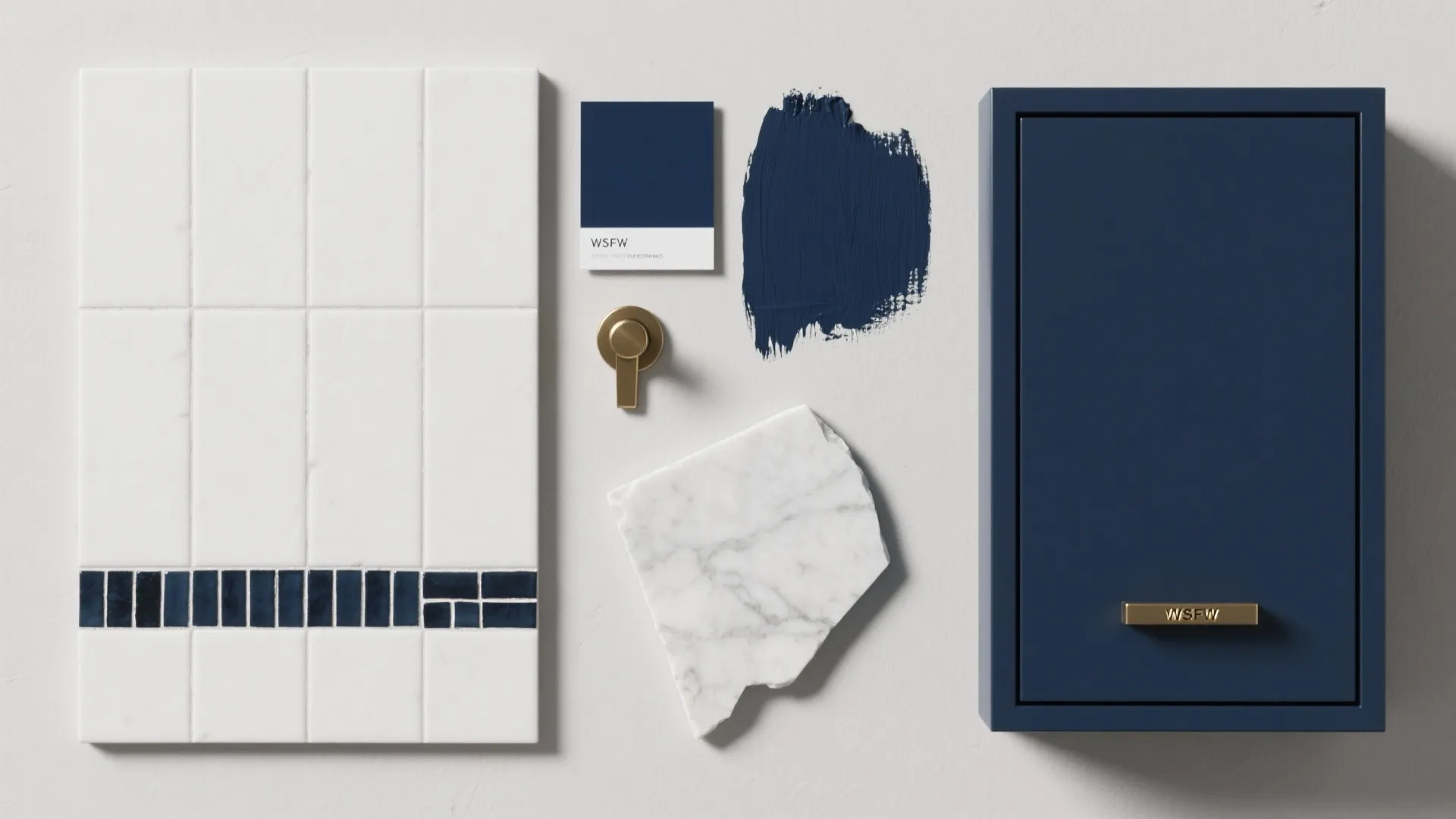 Interior design material board showing white tiles, marble, navy paint, and a dark blue cabinet