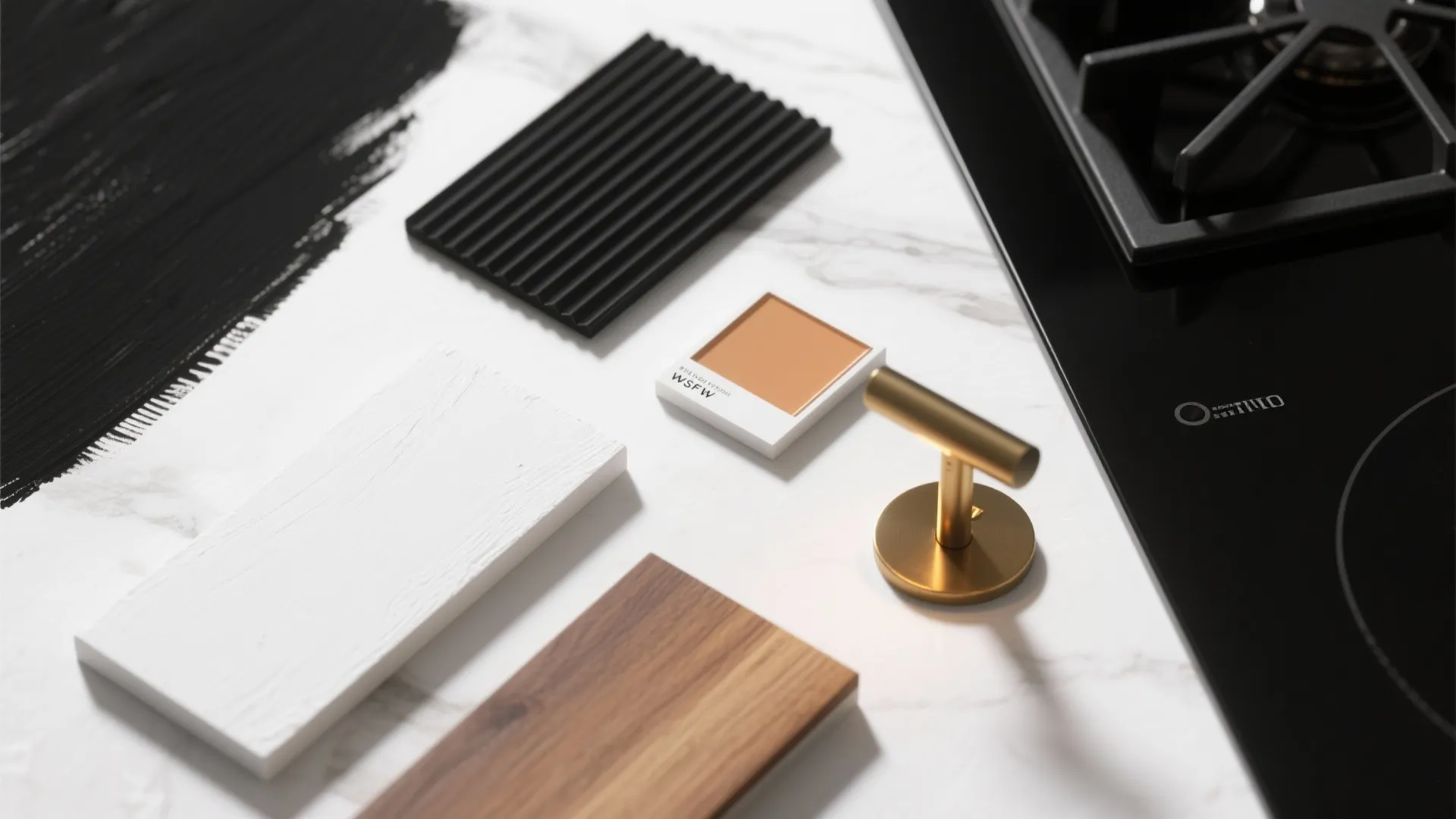 Flatlay of paint, wood and hardware samples for black-and-white kitchen finishes