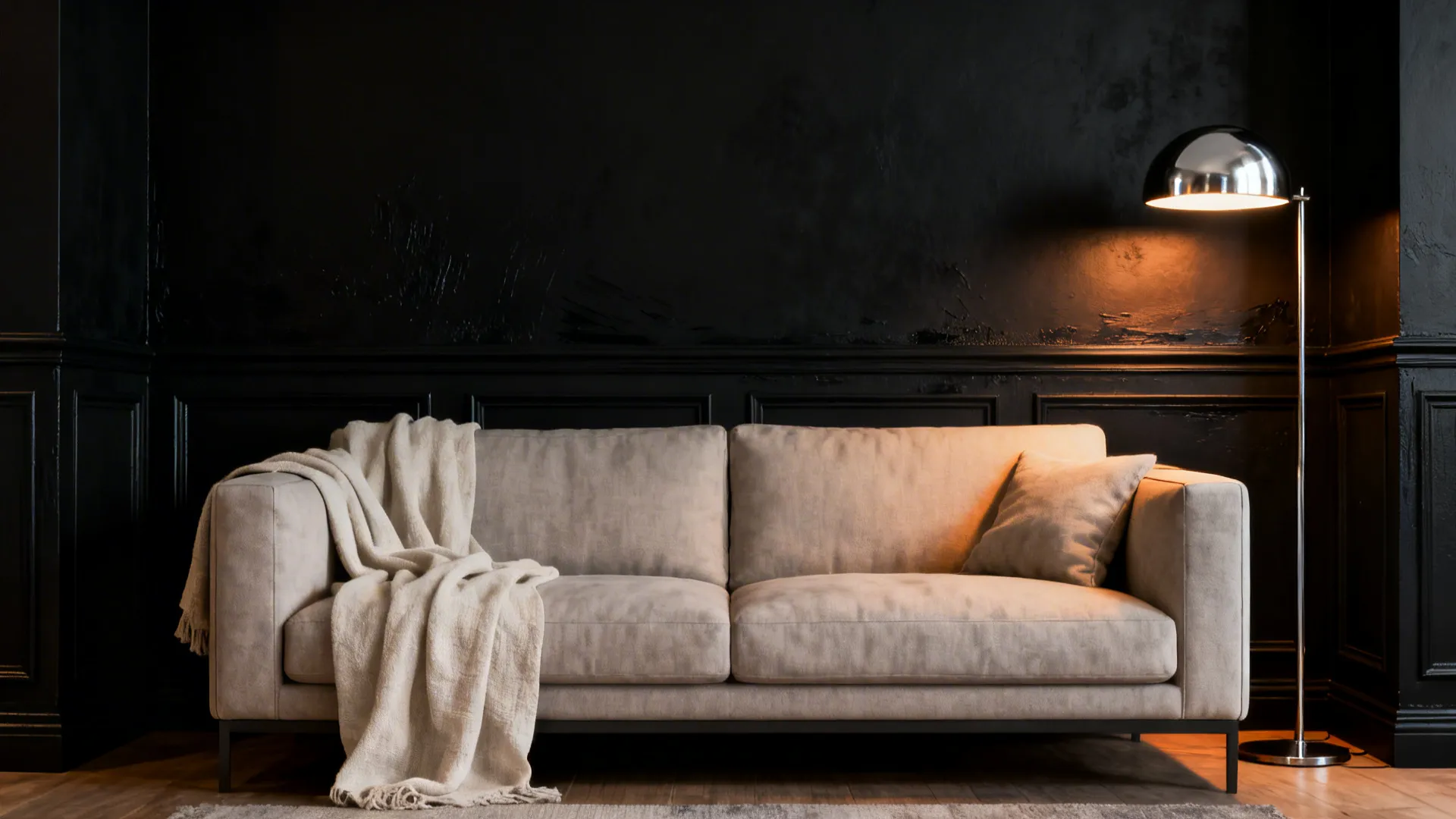 Living room seating nook with a matte black accent wall and light textiles for contrast.