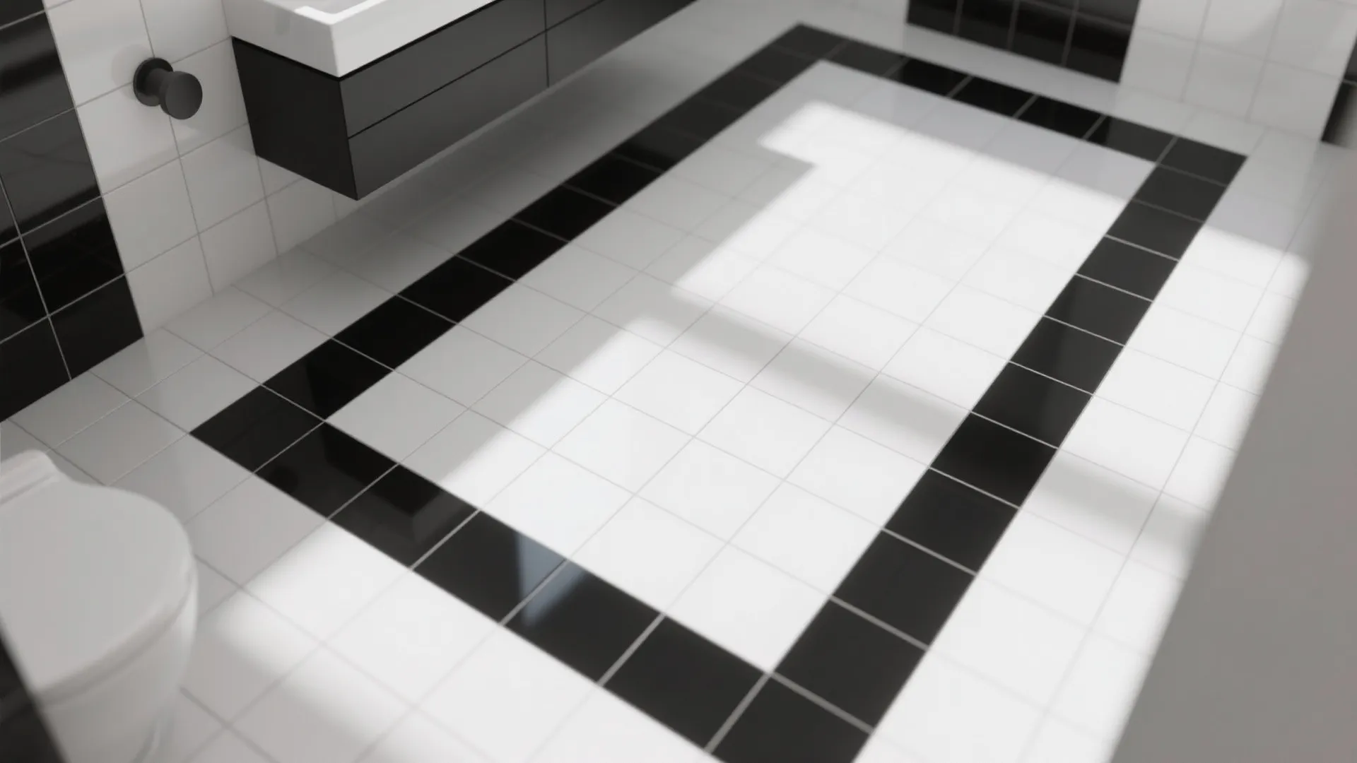 Modern bathroom floor with white tiles and a black tile border near a white toilet