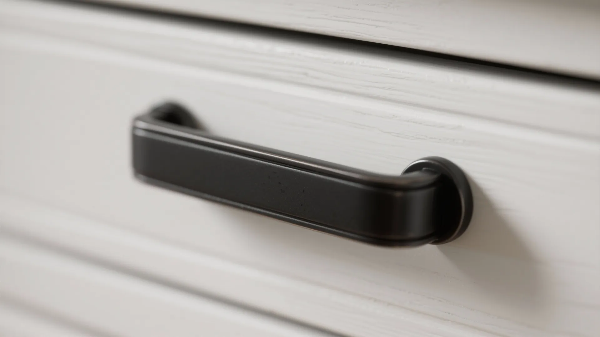 1. Matte black pulls on white shaker cabinets