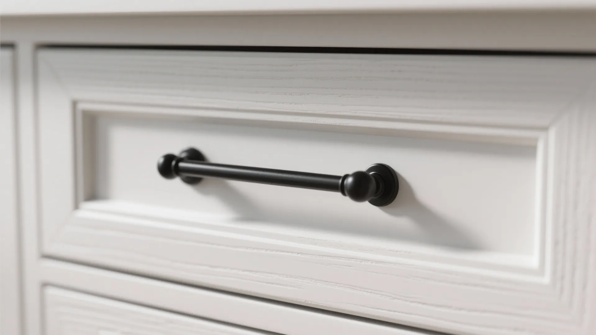 1. Matte black pulls on white shaker cabinets