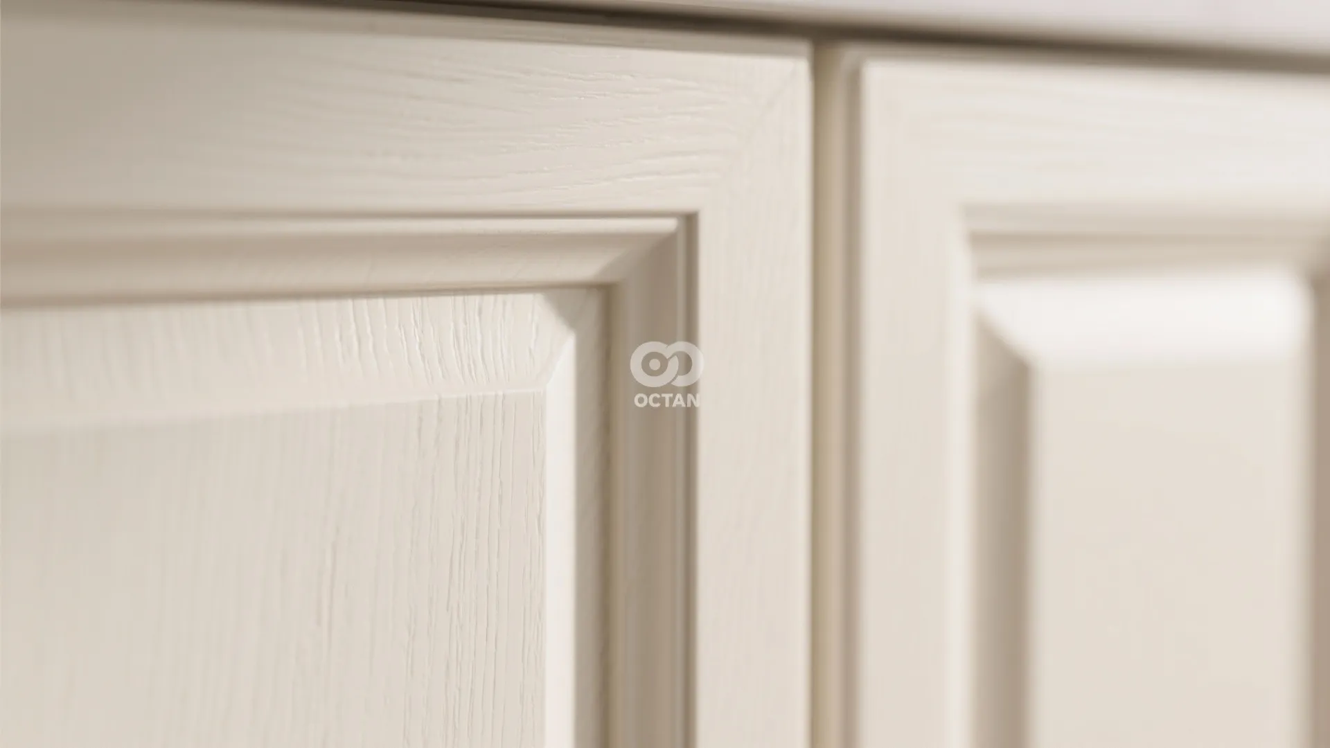 Macro detail of matte painted warm-white cabinet surface showing soft sheen and subtle texture.
