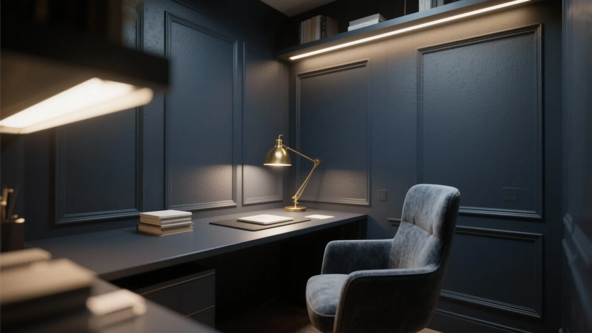 Modern dark blue office featuring wall panels with a gold desk lamp and velvet chair