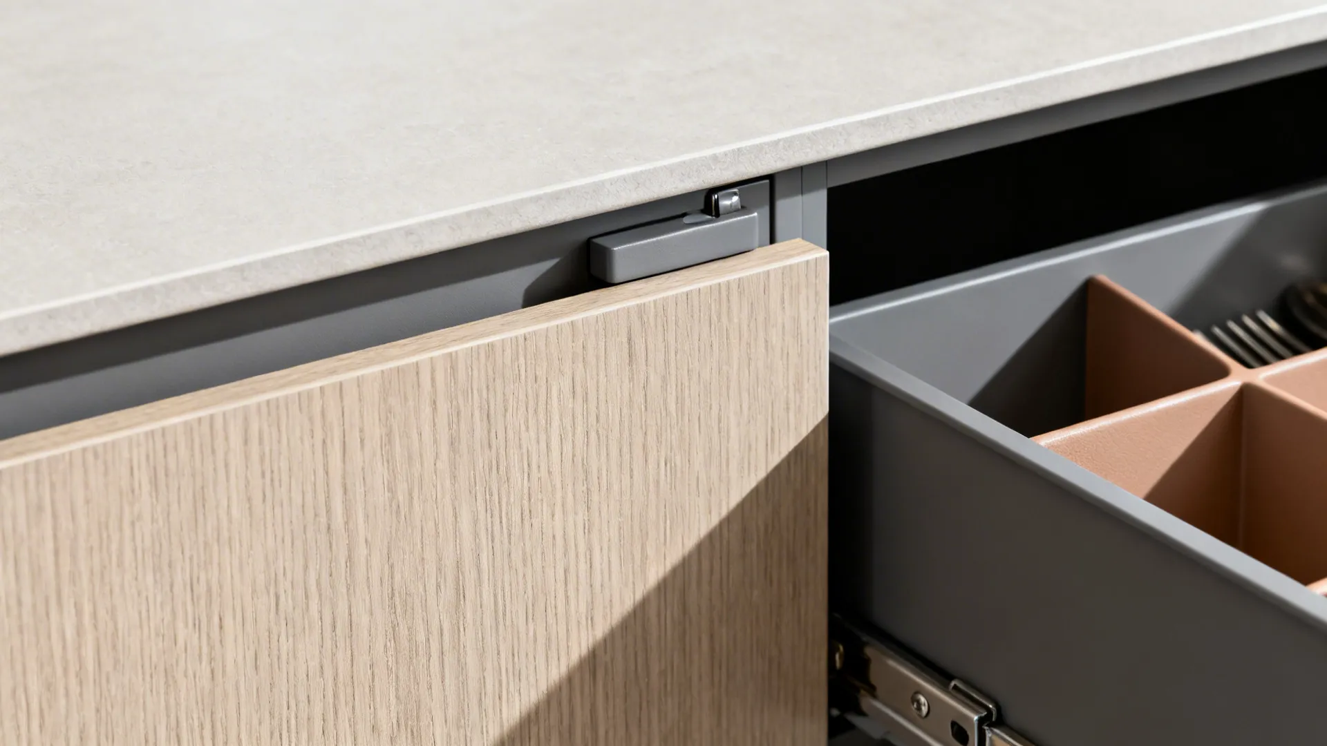 Macro of matte wood laminate cabinet with concealed pull and soft-close hinge.