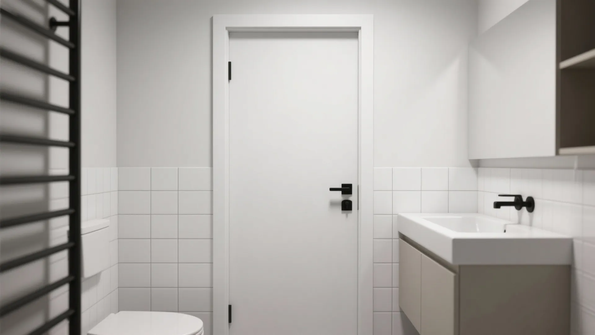 Minimalist white bathroom interior featuring plain white door black handle vanity sink and white tiled walls