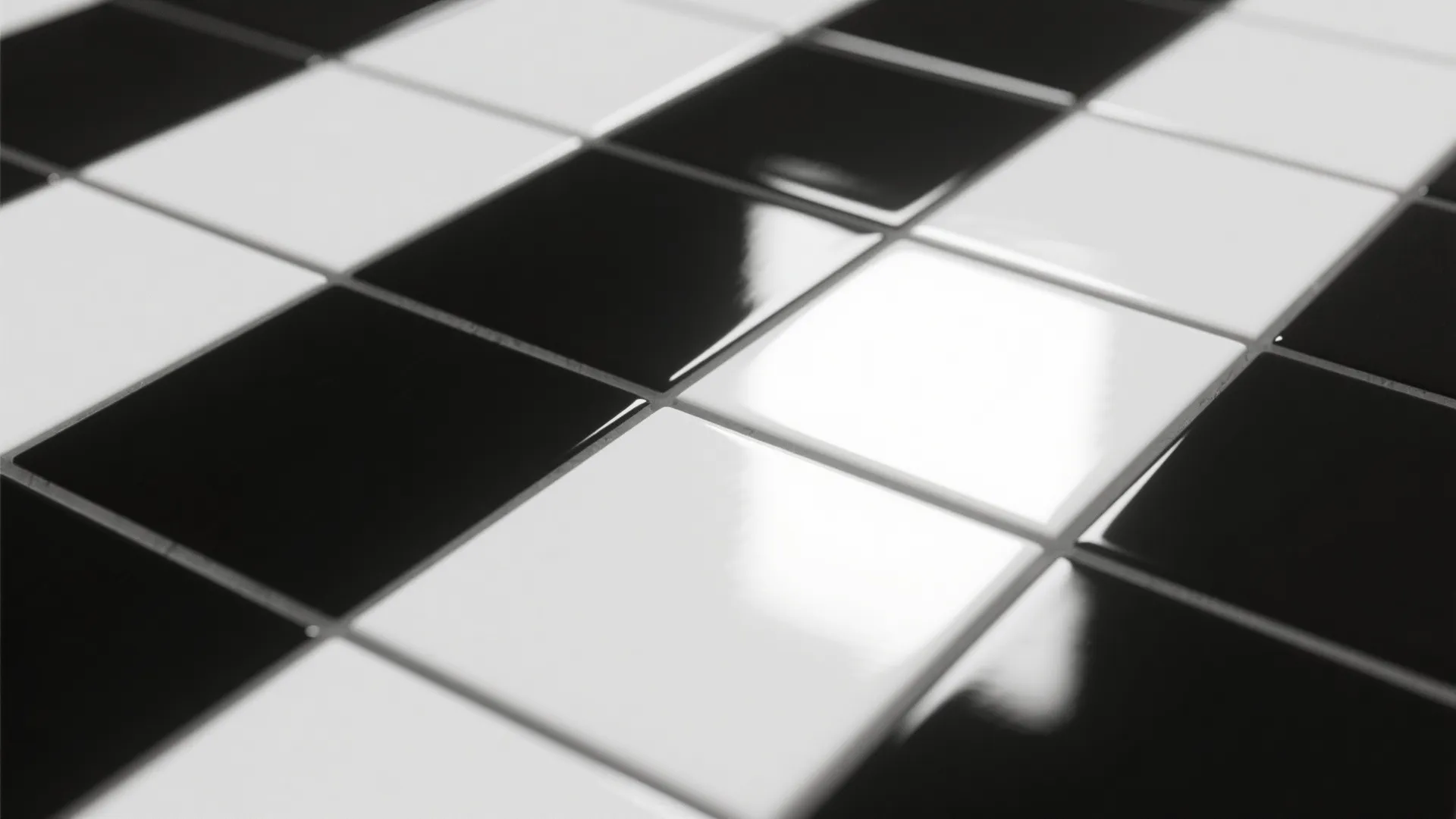 Close up view of glossy black and white square floor tiles with a smooth reflective finish