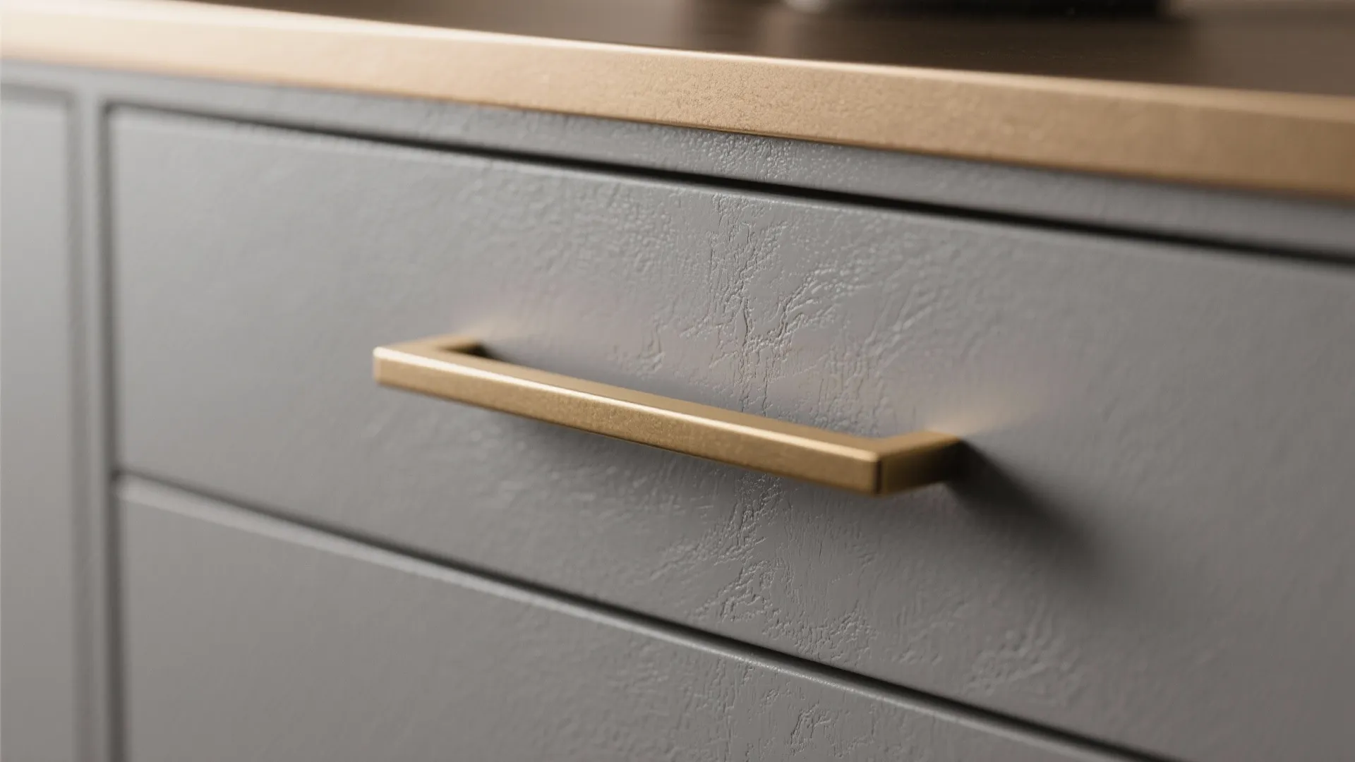 2. Matte grey cabinets with brass hardware for subtle luxury