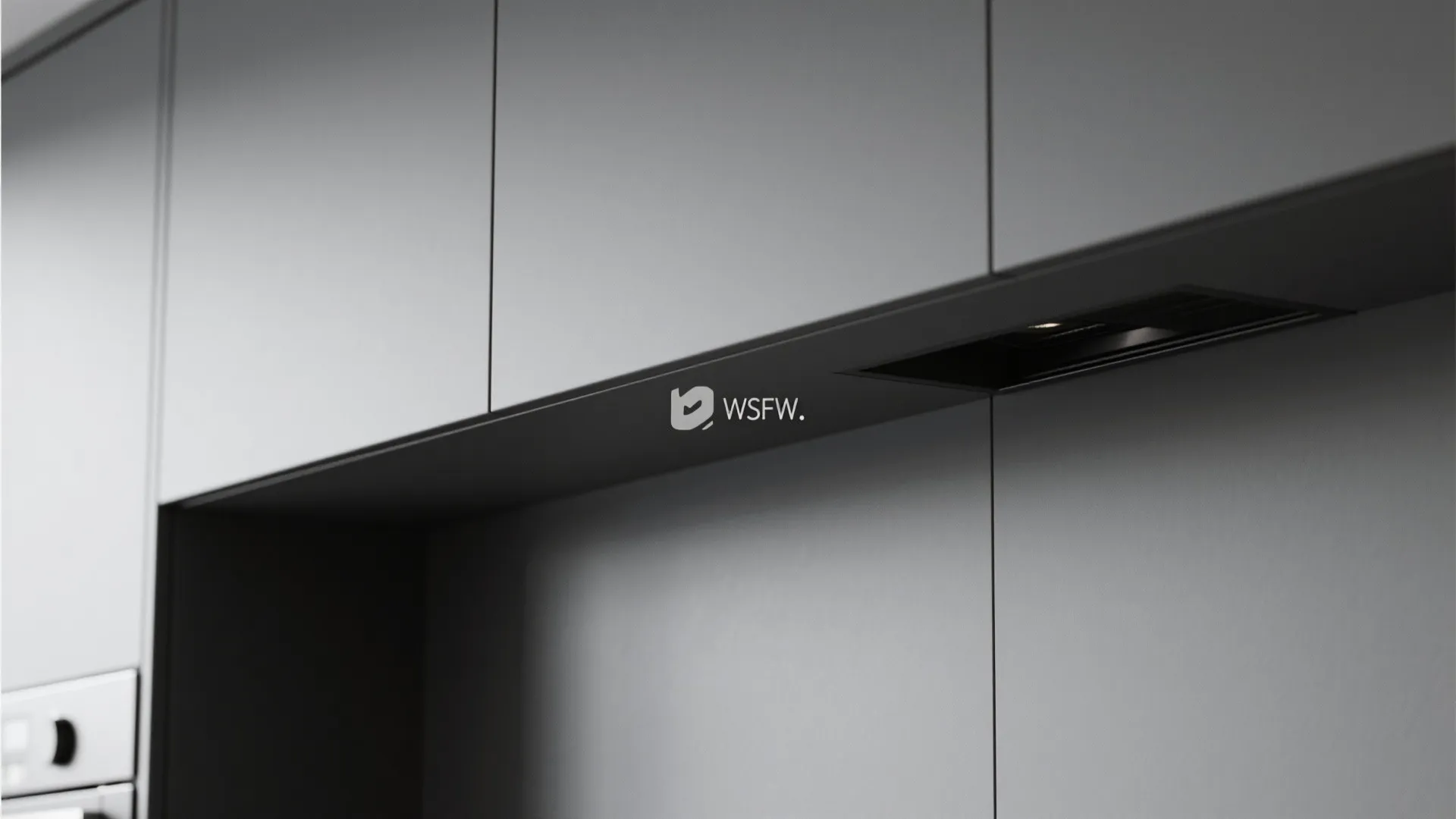 Minimalist matte grey kitchen cabinets with a built in light fixture and clean modern lines
