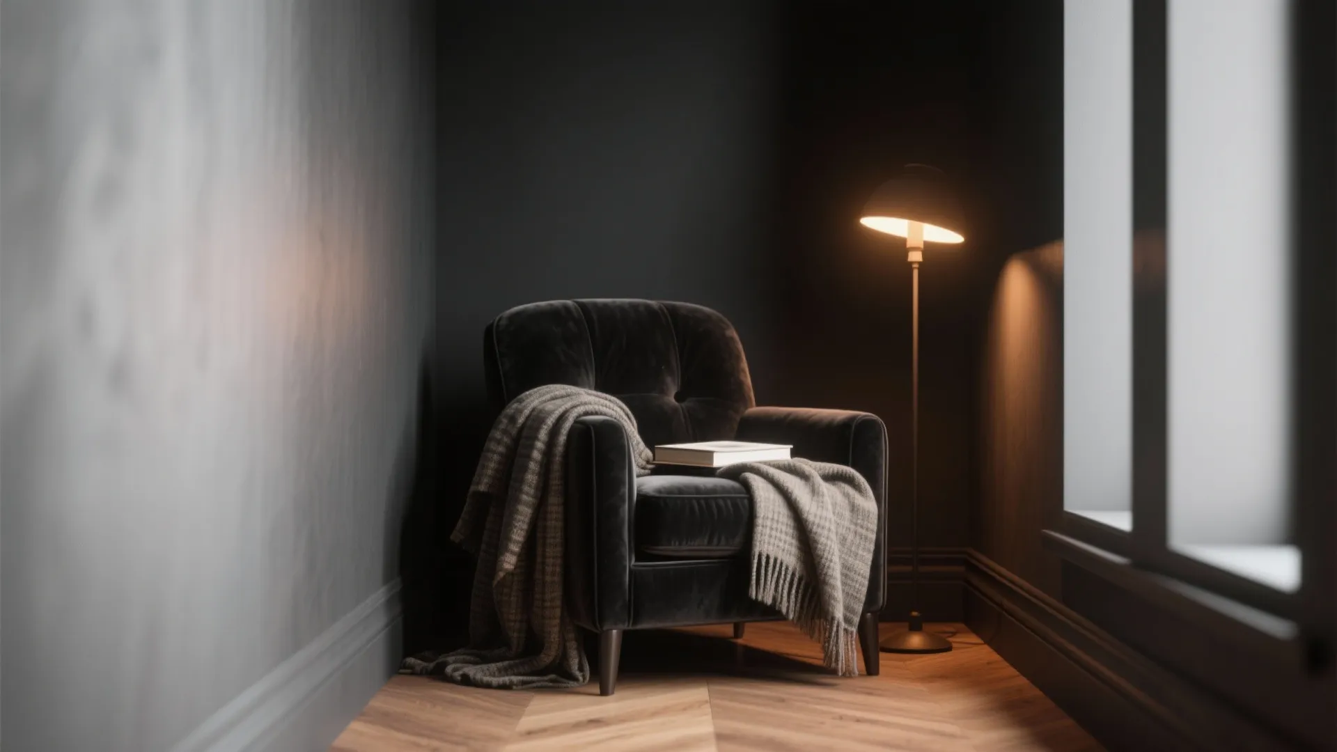 Cozy reading nook in a small apartment with a matte black corner, velvet chair, and warm lamp.