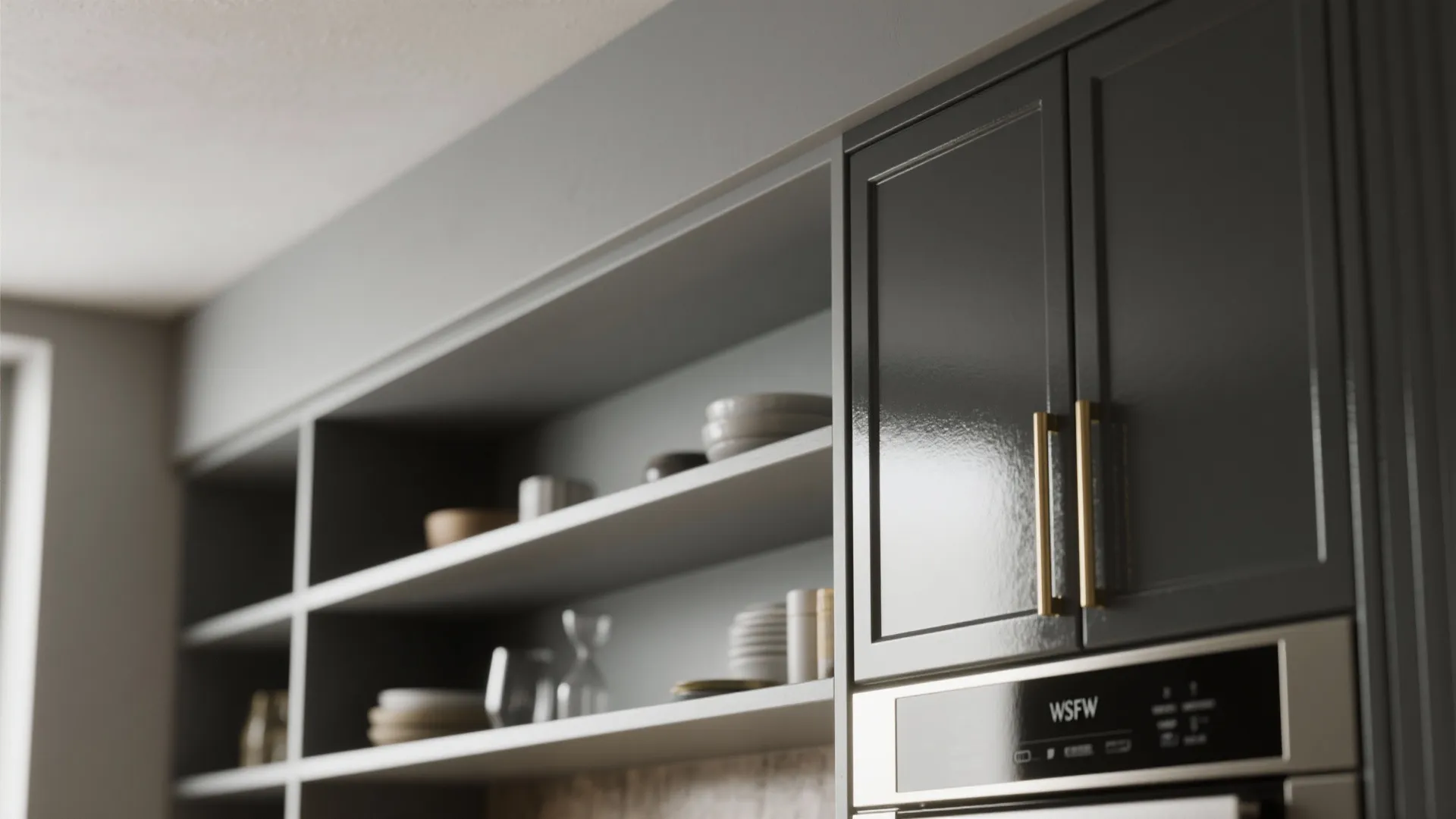 Close-up of open shelving underside in ultra-matte paint contrasted with glossy cabinet face and brass hardware.