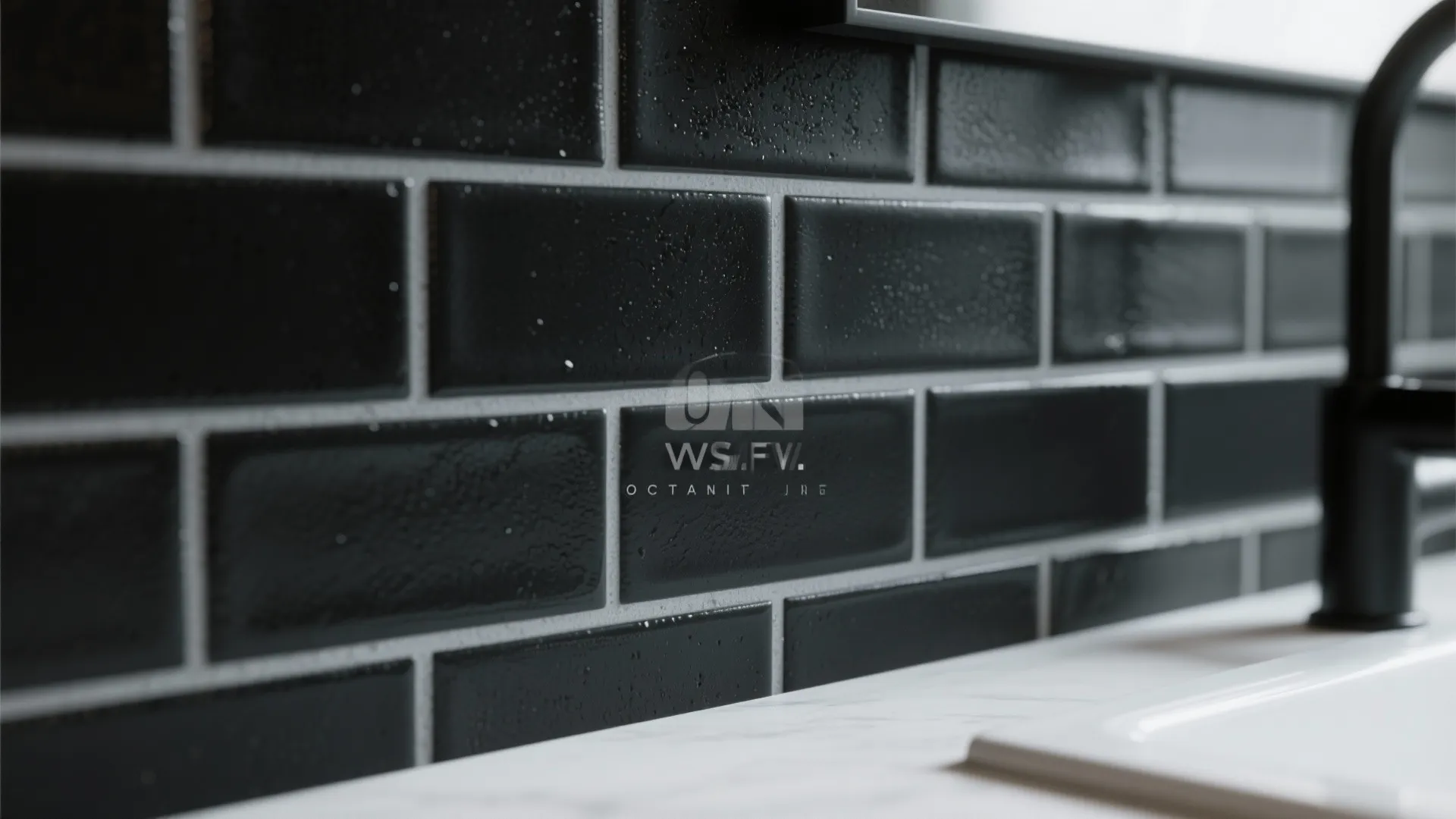 Close up of black wall tiles with white grout behind a kitchen sink and faucet