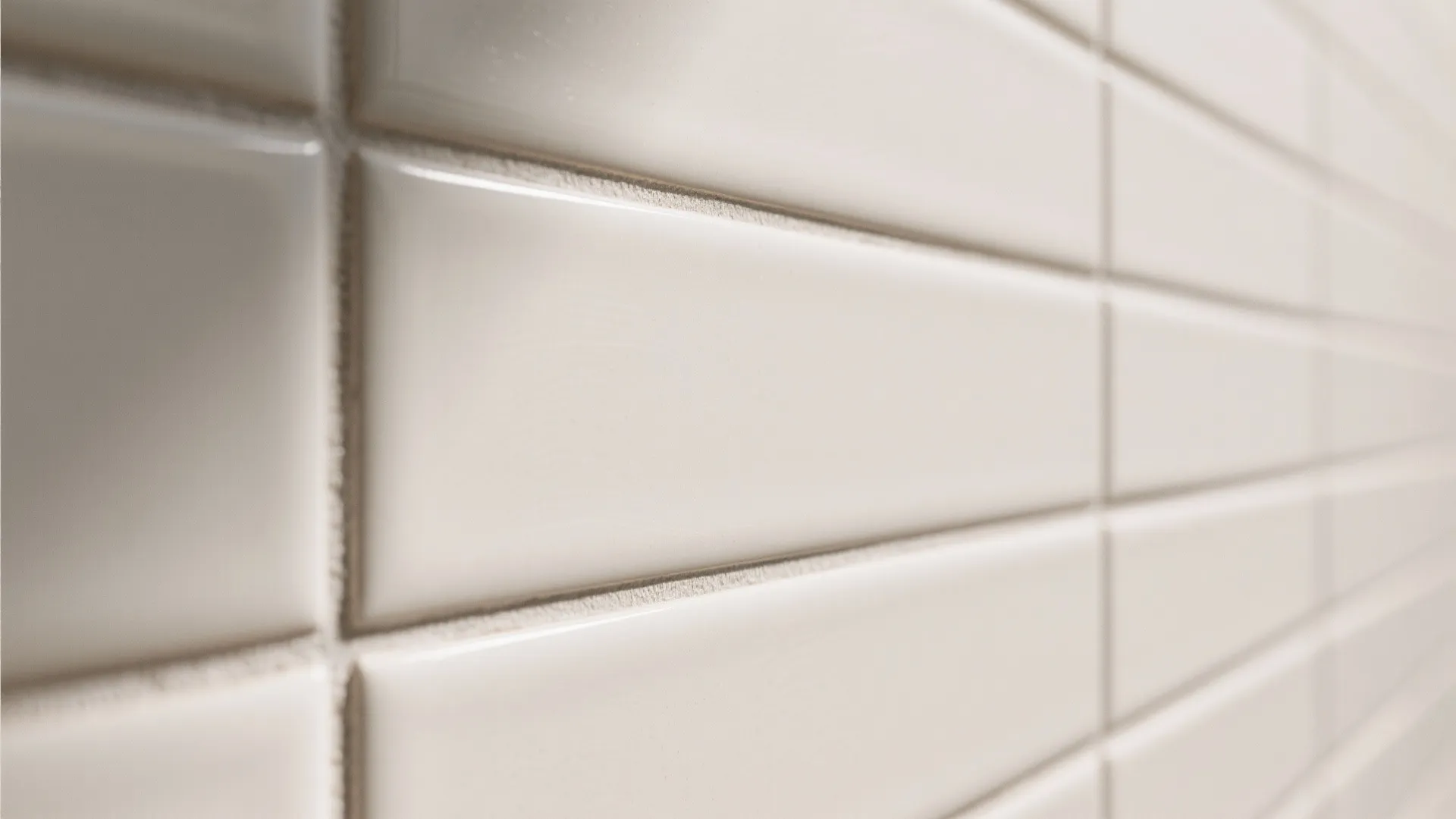 Macro view of matte subway tiles with fine, color-matched grout lines.