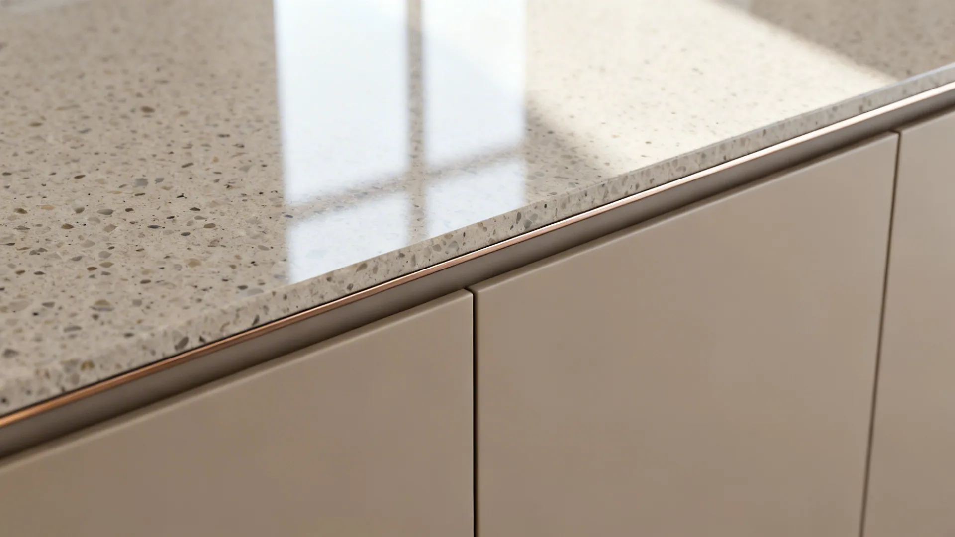 Macro view of matte cabinet front with micro-terrazzo countertop and refined edge profile.