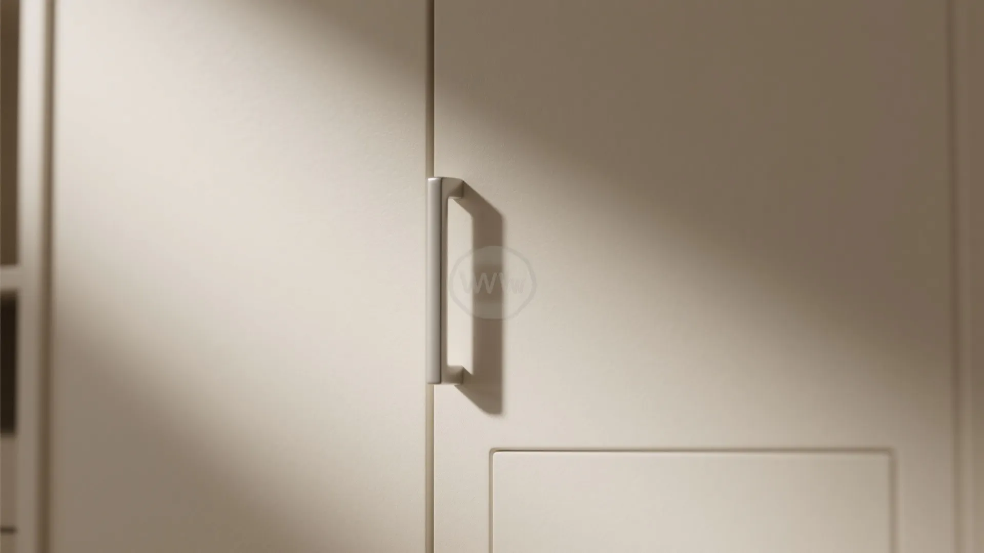 Close-up of matte warm white cabinet surface showing texture and finish