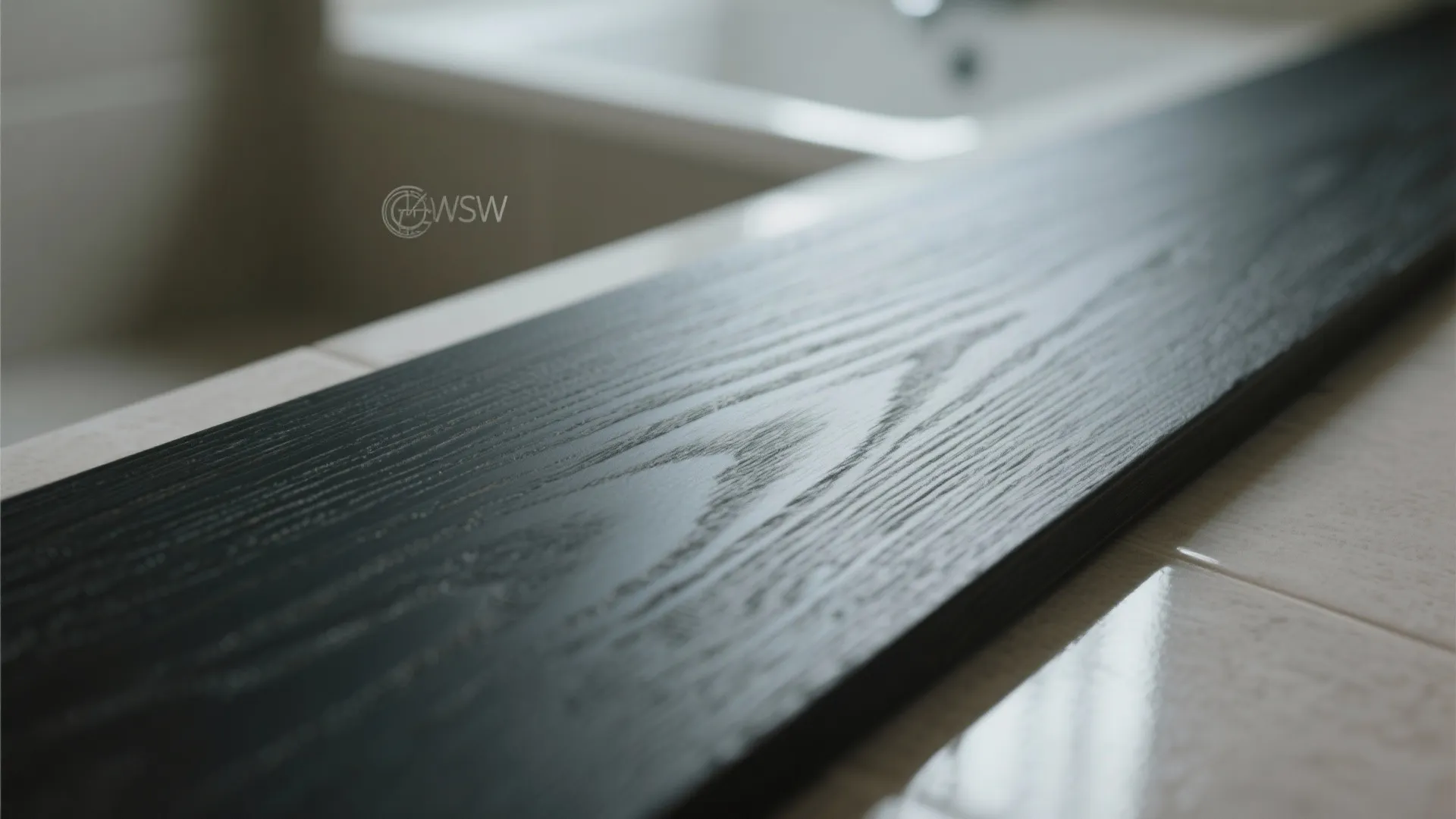 Close up of a dark wood floor board with visible grain texture on white tiles