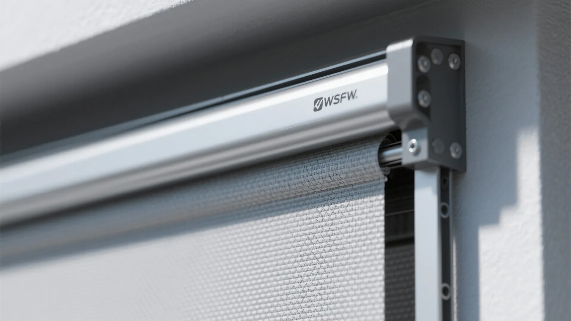 Macro of zip-track mesh and hem bar used in a wind-resistant awning system for balconies.