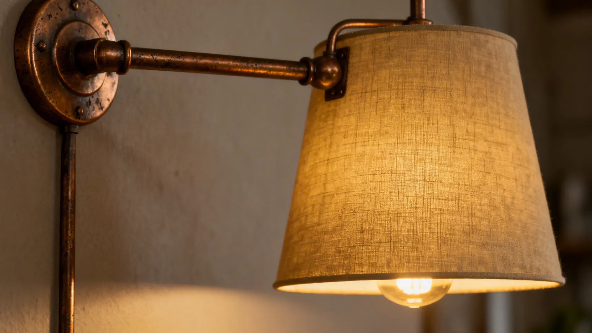 Metal industrial farmhouse lamp with rubbed bronze finish and fabric shade