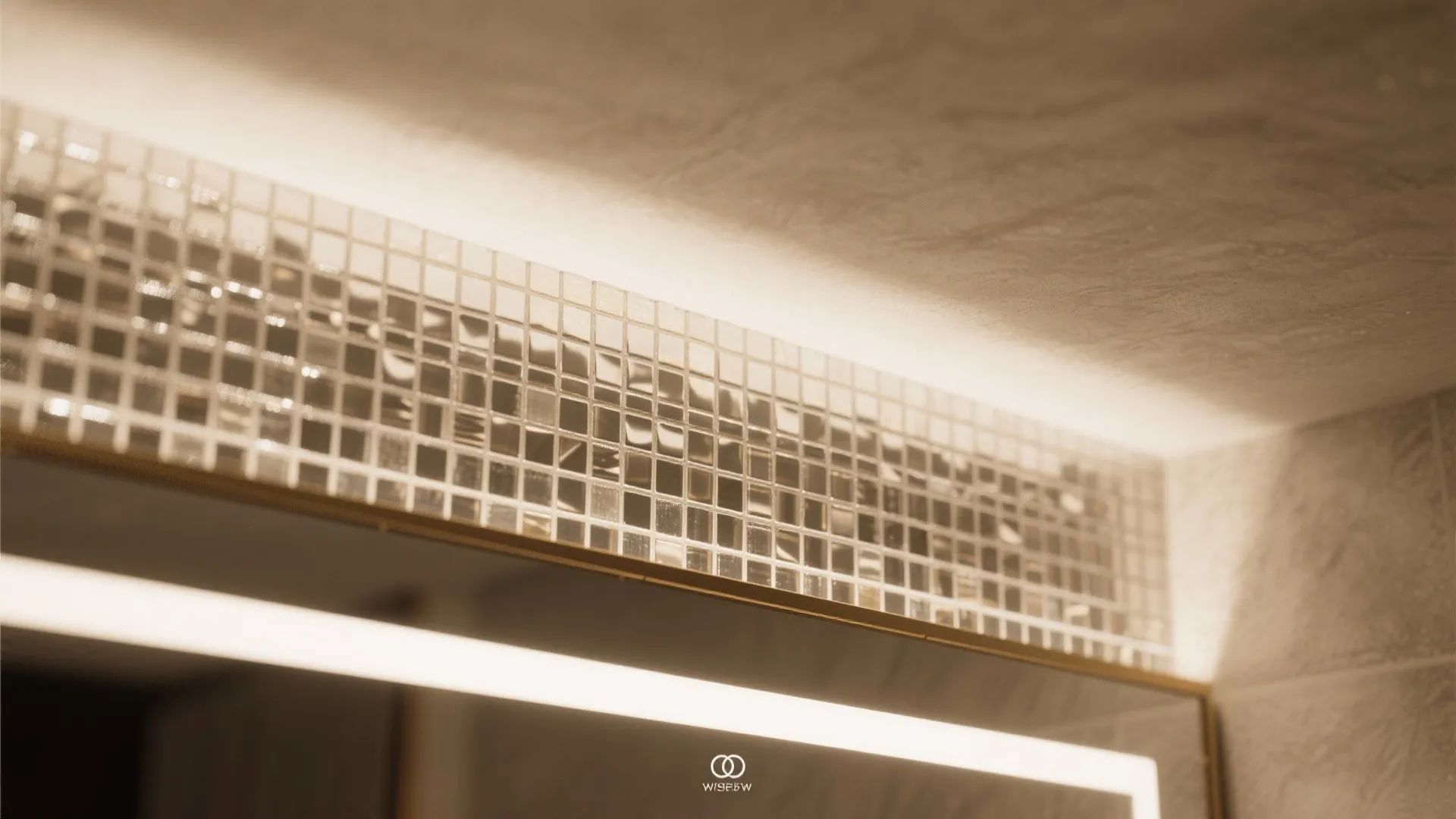 Close up of a metallic decorative strip with square tile patterns under a warm light