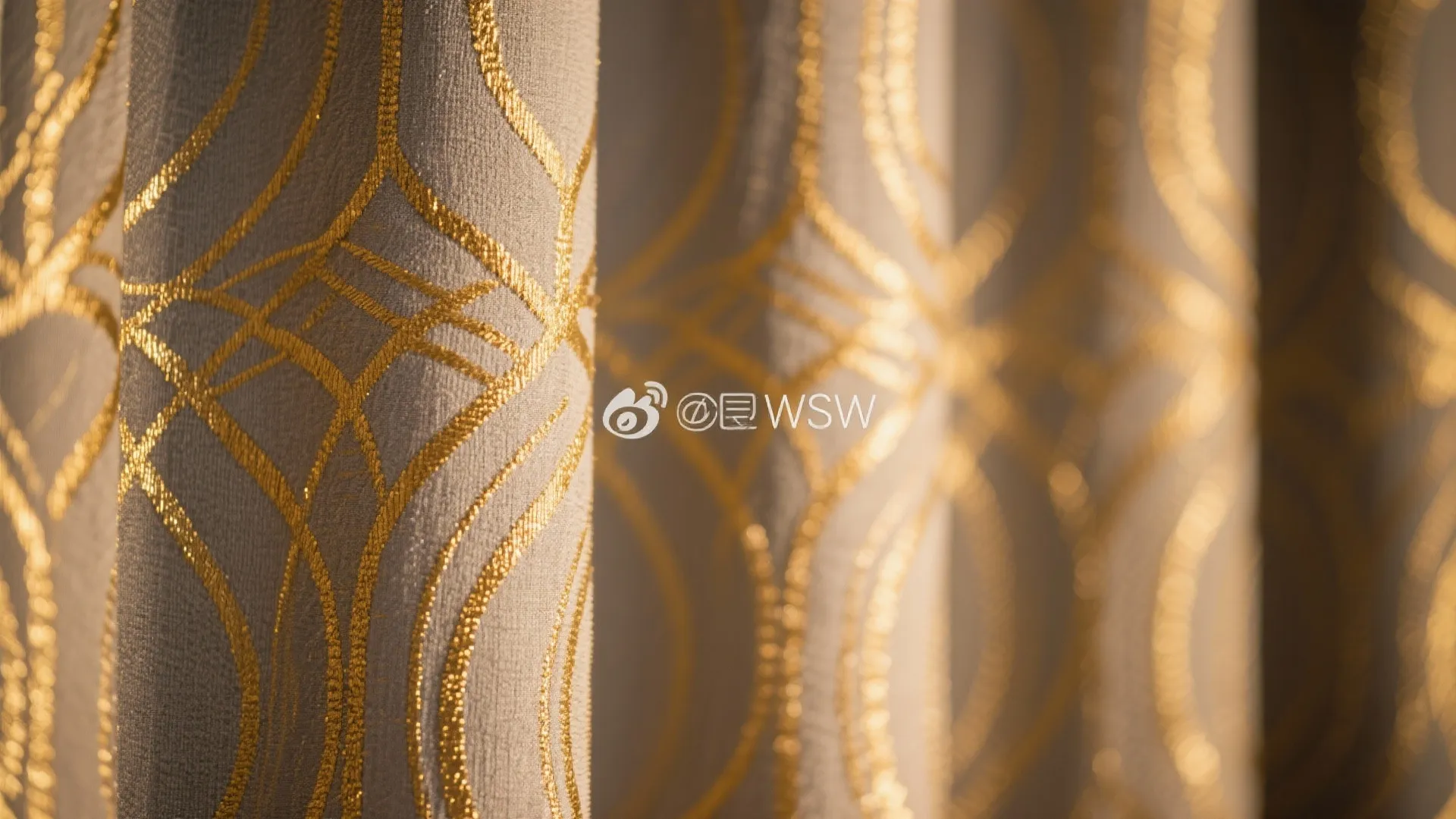 Close up of grey fabric with gold circular patterns used for elegant curtains in home