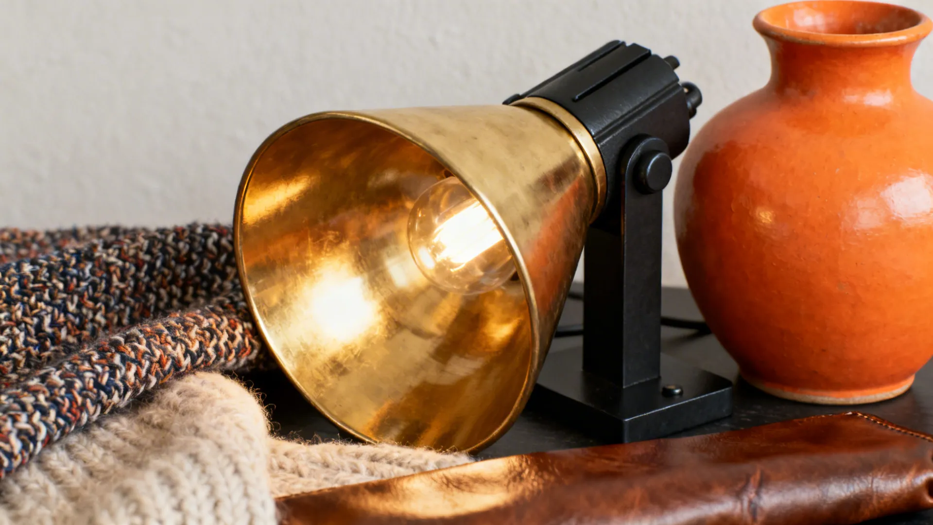 Brass lighting, matte black hardware and diverse textures tying blue and orange together.