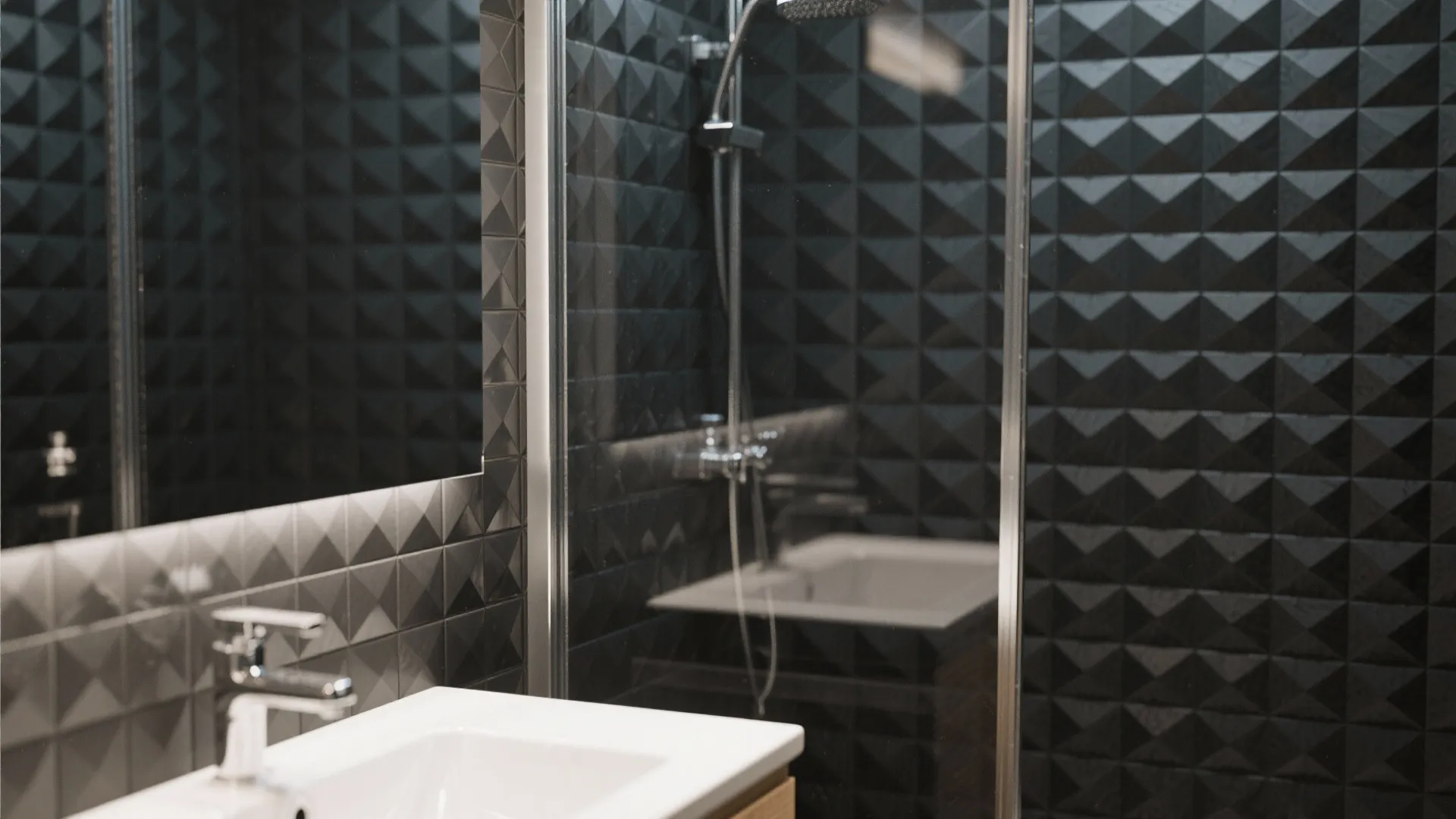 Modern bathroom with black textured wall tiles white sink mirror and glass shower door setup