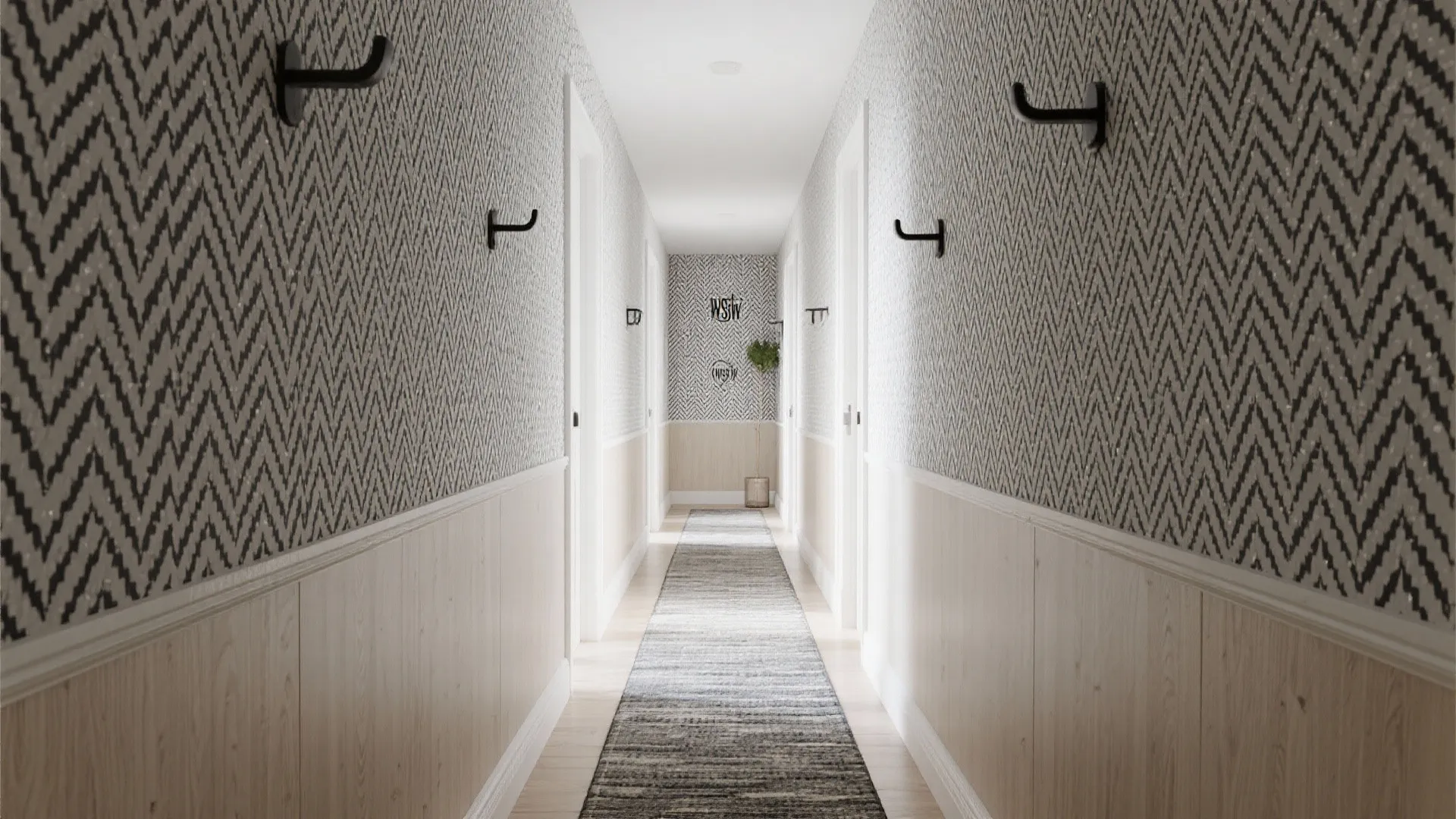 Narrow hallway with chevron wallpaper light wall panel black wall hooks and long grey floor rug