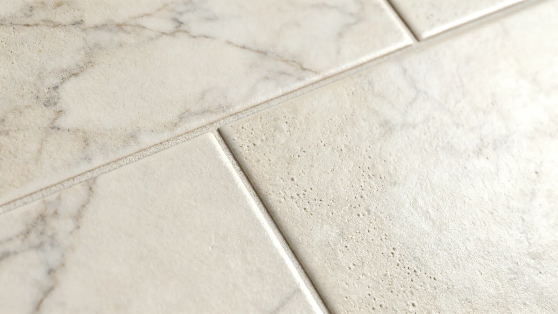 Macro of micro-textured stone-look porcelain with subtle veining under soft light.