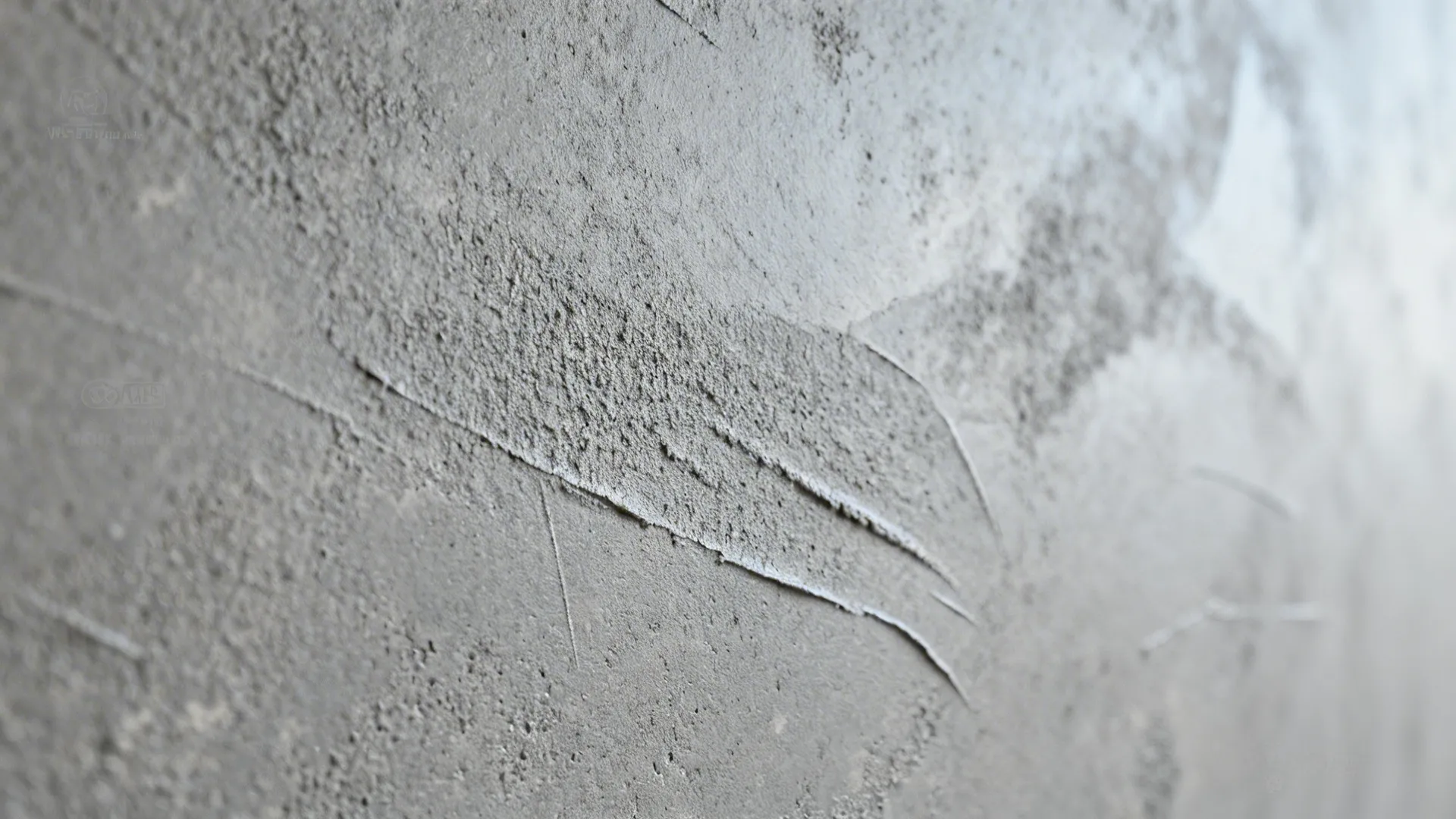 Macro detail of microcement showing fine texture and matte finish under grazing light.