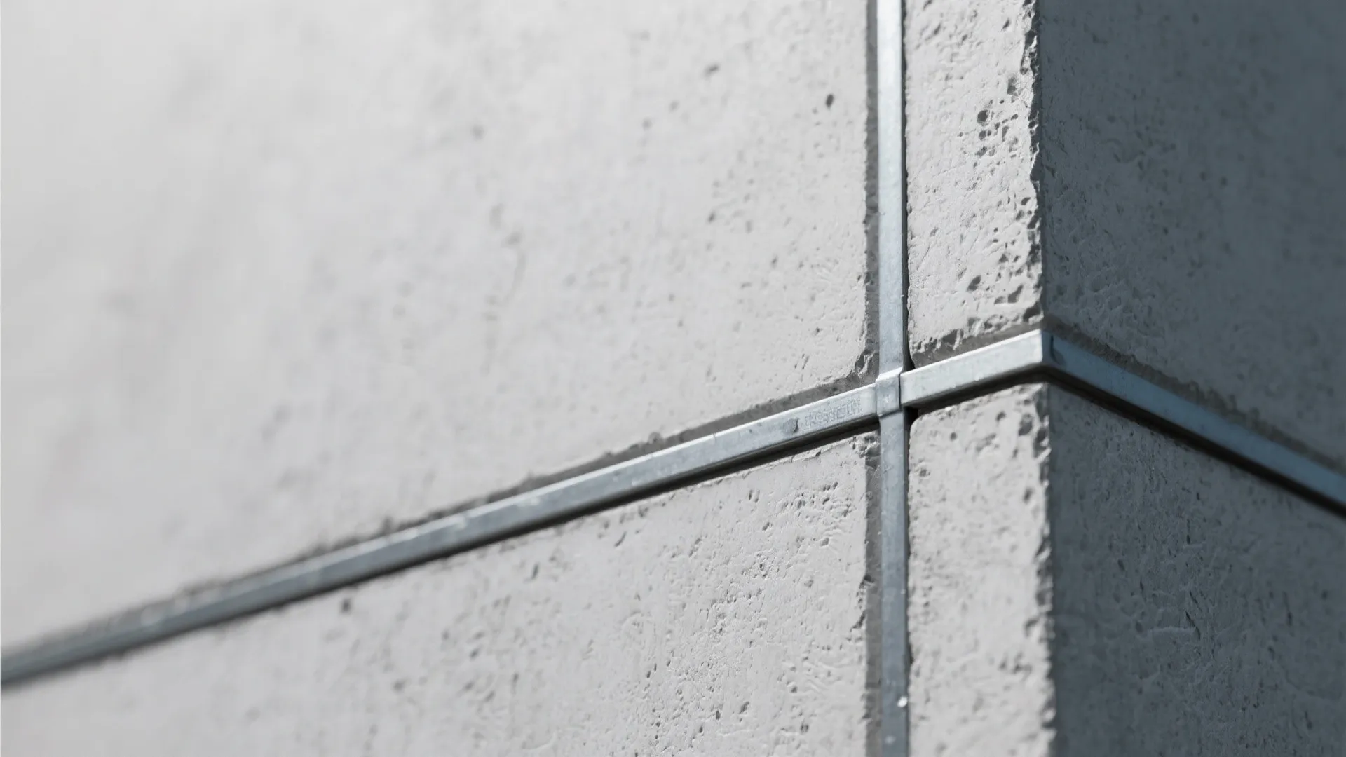 Macro of microtop concrete texture on fiber-cement over a slim steel frame.