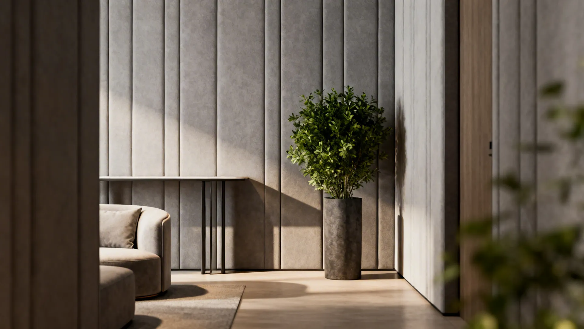 Compact living room with soft mid-grey vertical paneling, minimal furniture and a tall plant.
