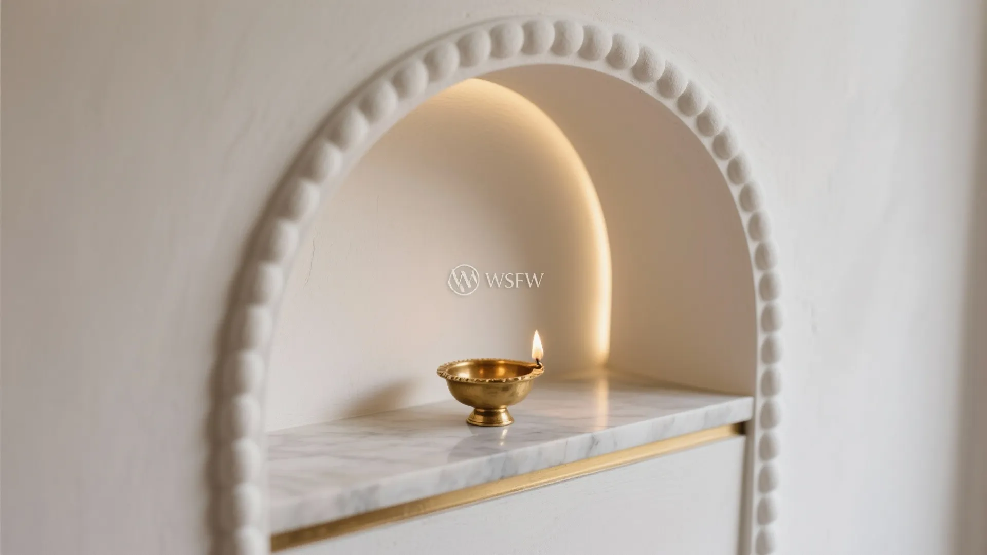 Minimalist arched niche for a calm mandir