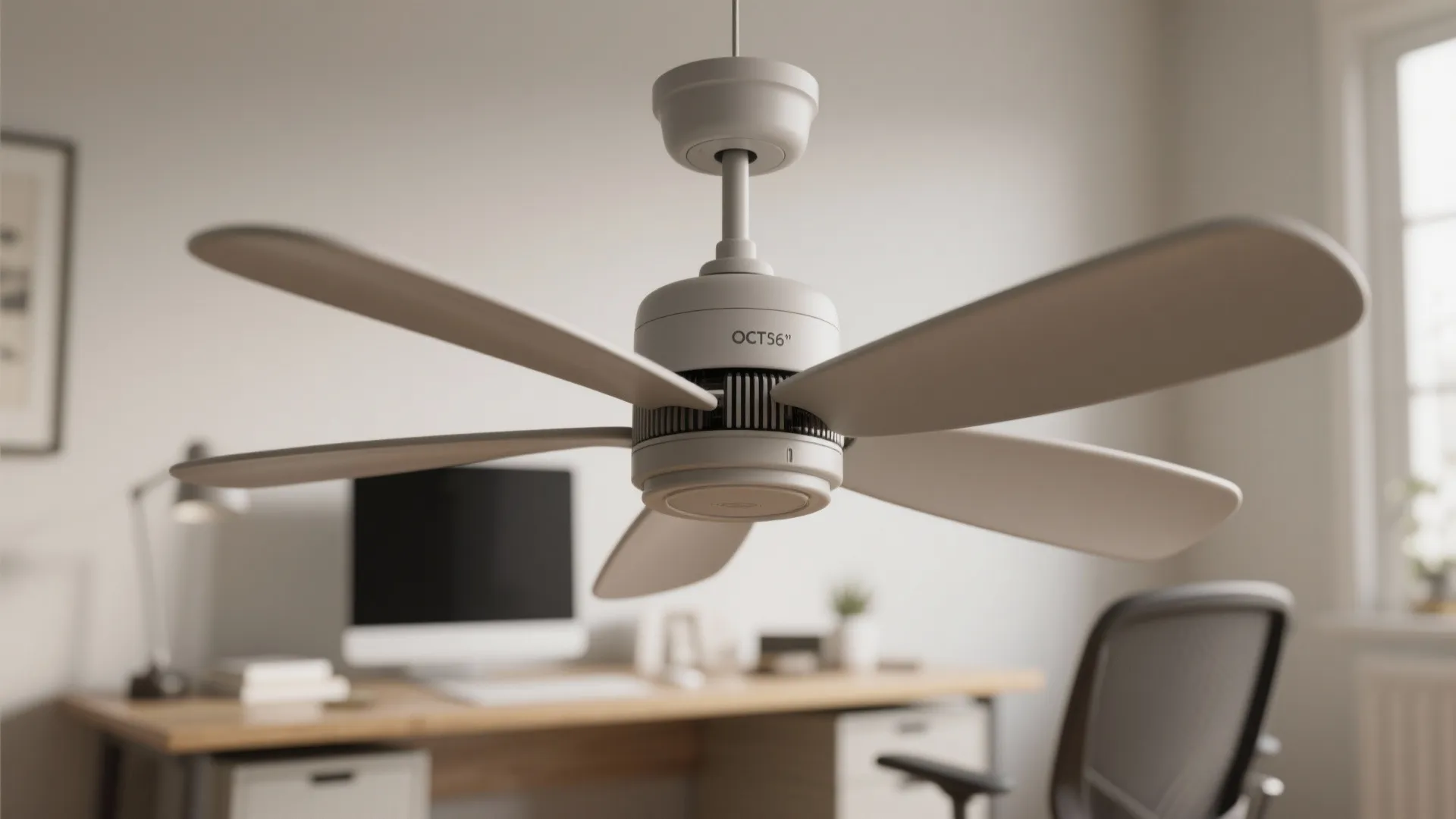 White ceiling fan with six blades hanging in a home office with a wooden desk