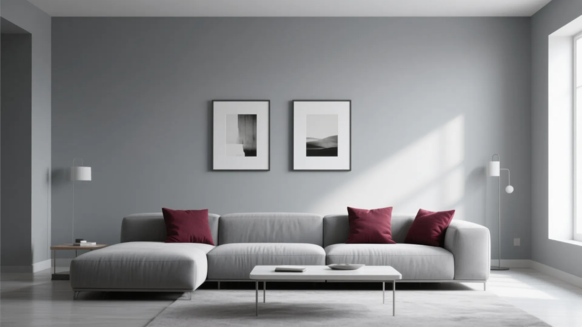 Minimalist gray living room with burgundy pillows and art