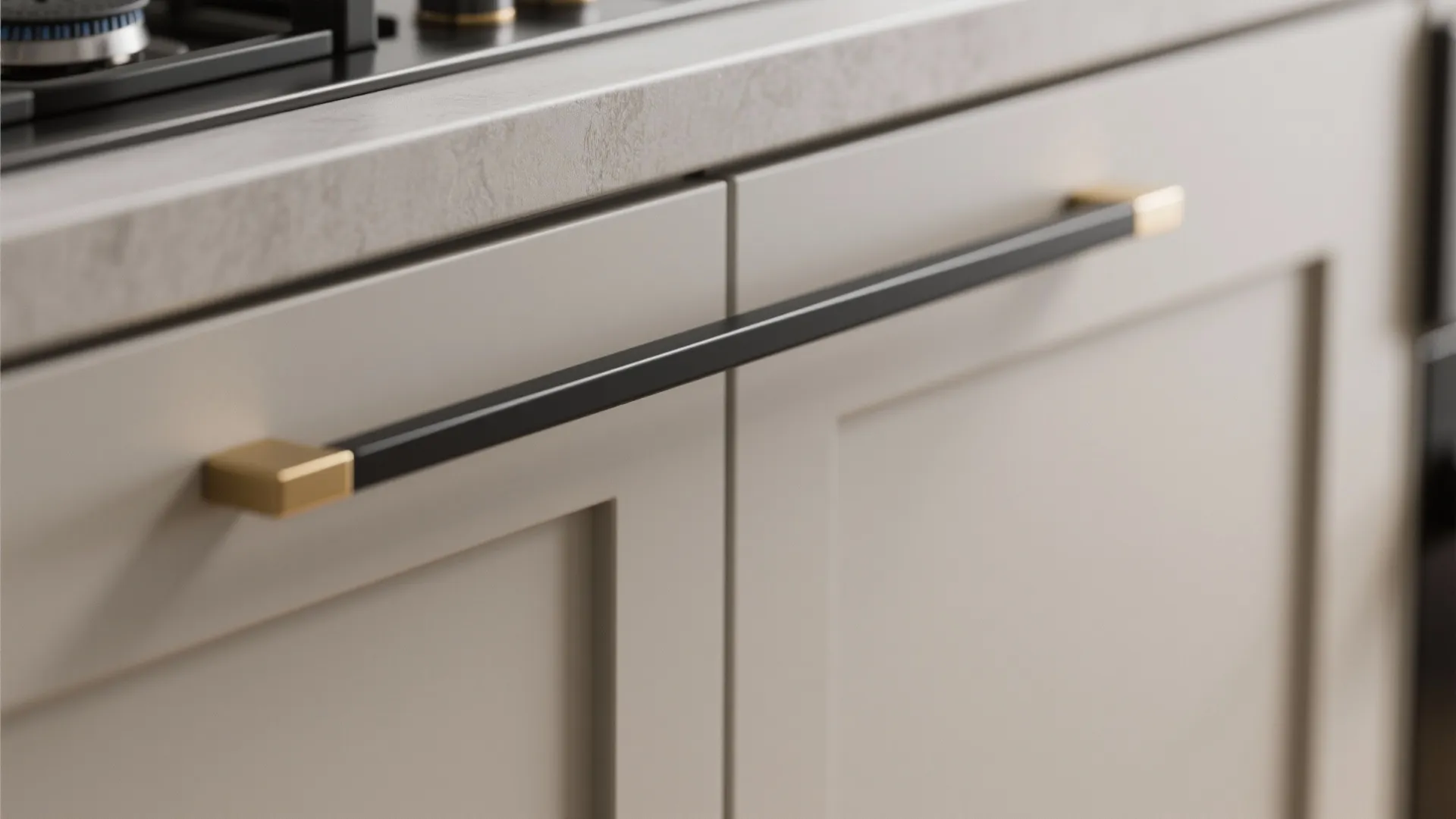 Slim black and brass handles on matte cabinets