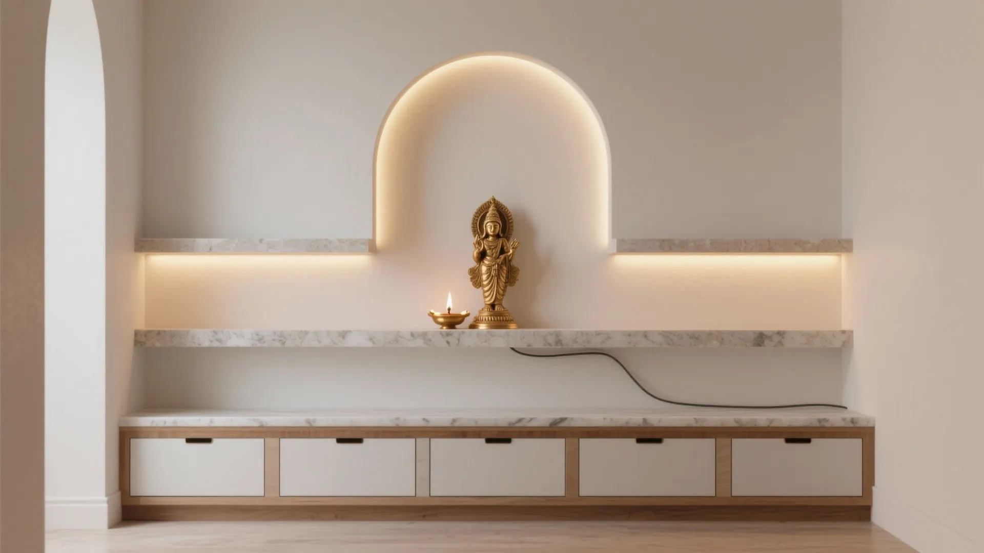 Modern room with an arched wall niche featuring a golden statue marble shelves and cabinets