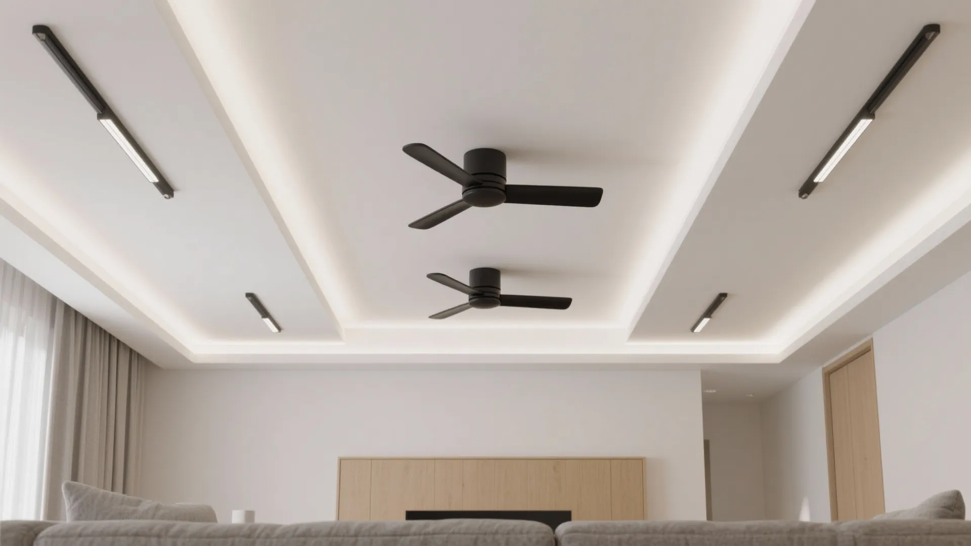 Modern white ceiling design featuring two black ceiling fans track lights and hidden warm lighting